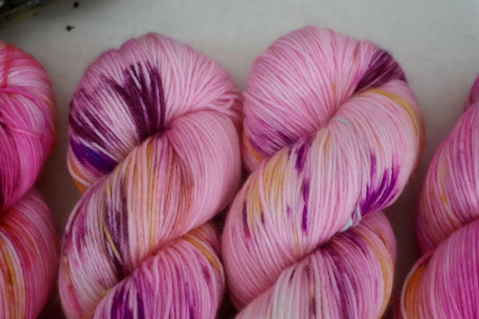 A vibrant floral colourway inspired by the Royal Botanic Garden Edinburgh. Hand‑dyed 4‑ply merino/nylon yarn with rich pinks, purples, and warm botanical tones.