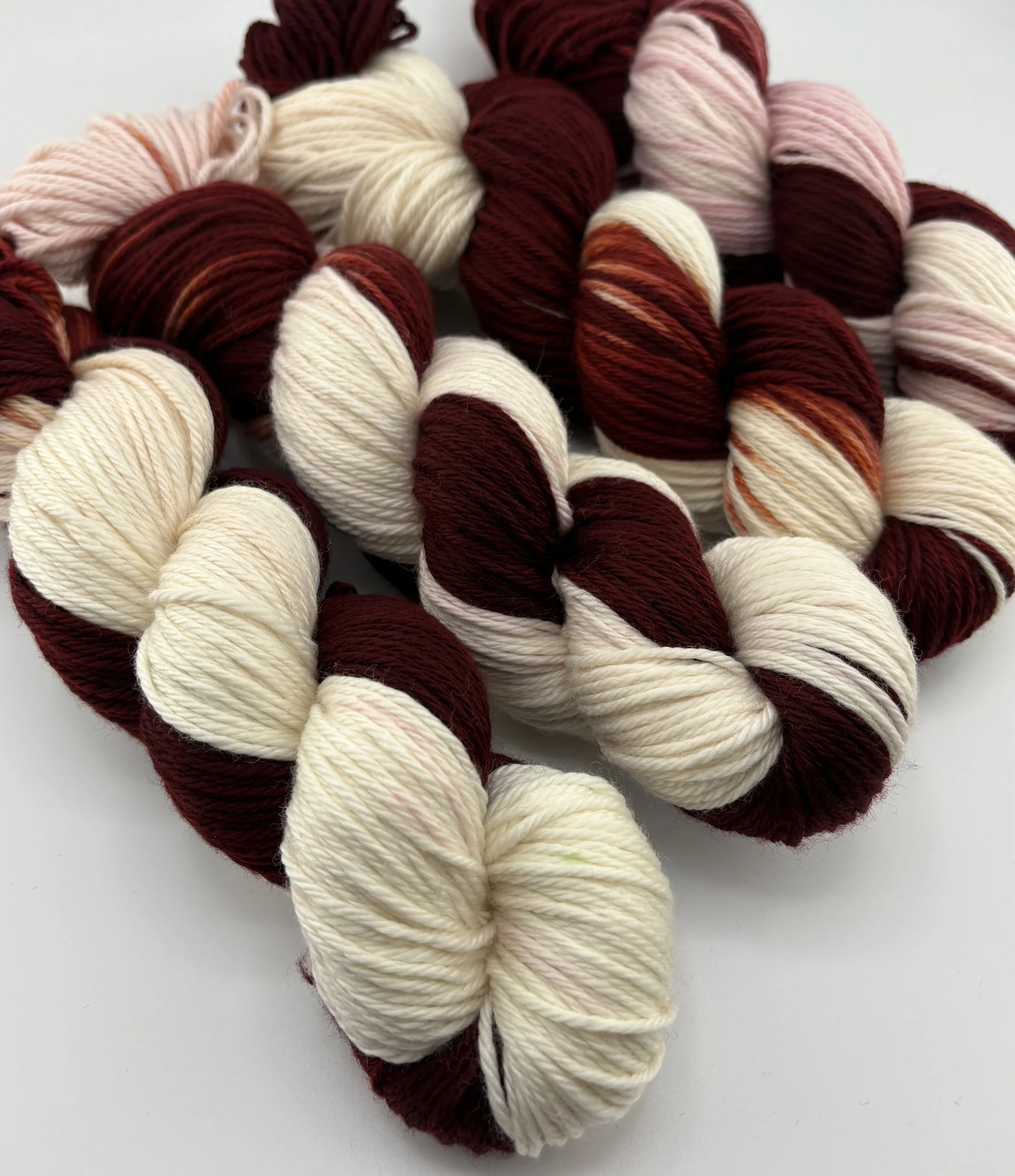Hand-dyed yarn skeins in Maroon and White