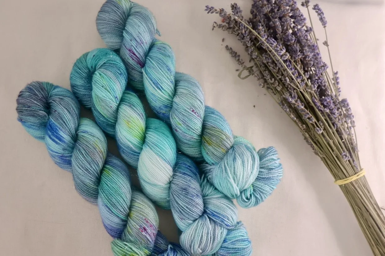 A dusk‑inspired colourway featuring deep marine blues and soft evening tones. Gloaming Waters is hand‑dyed on a merino/nylon 4‑ply base in Scotland.