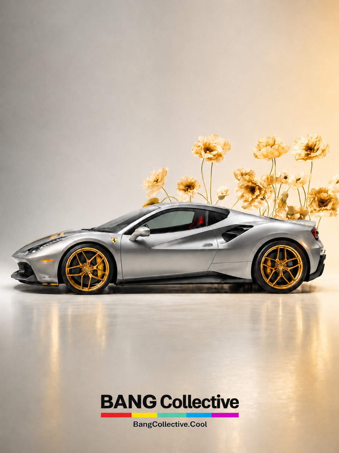 A silver Ferrari sports car with gold wheels and a Ferrari logo on the side, set against a plain background with yellow flowers behind it. Text at the bottom reads 'BANG Collective' and 'BangCollective.Cool'.