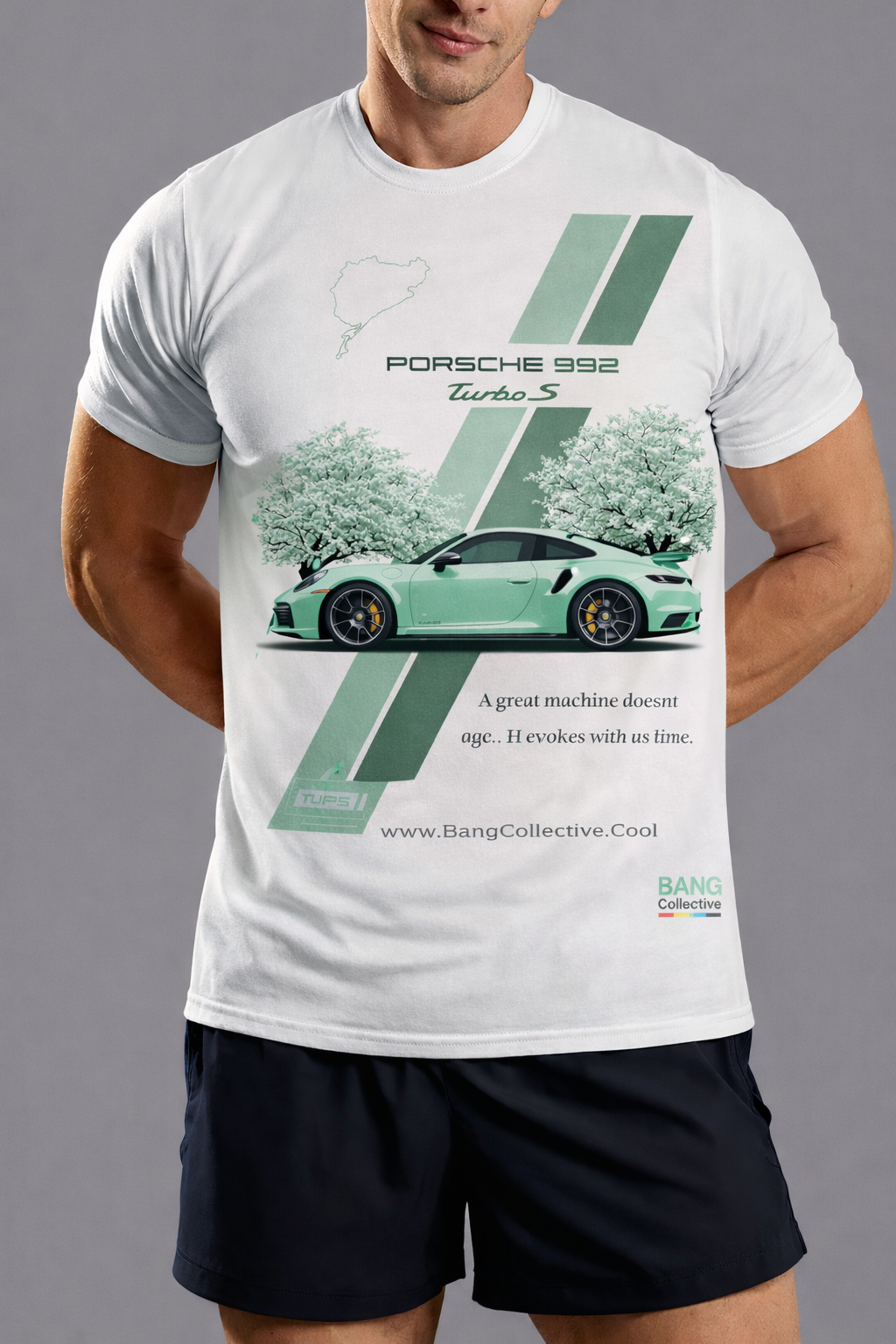A man wearing a white T-shirt with a graphic design of a green Porsche 992 Turbo S car, trees, and text, standing against a plain gray background.