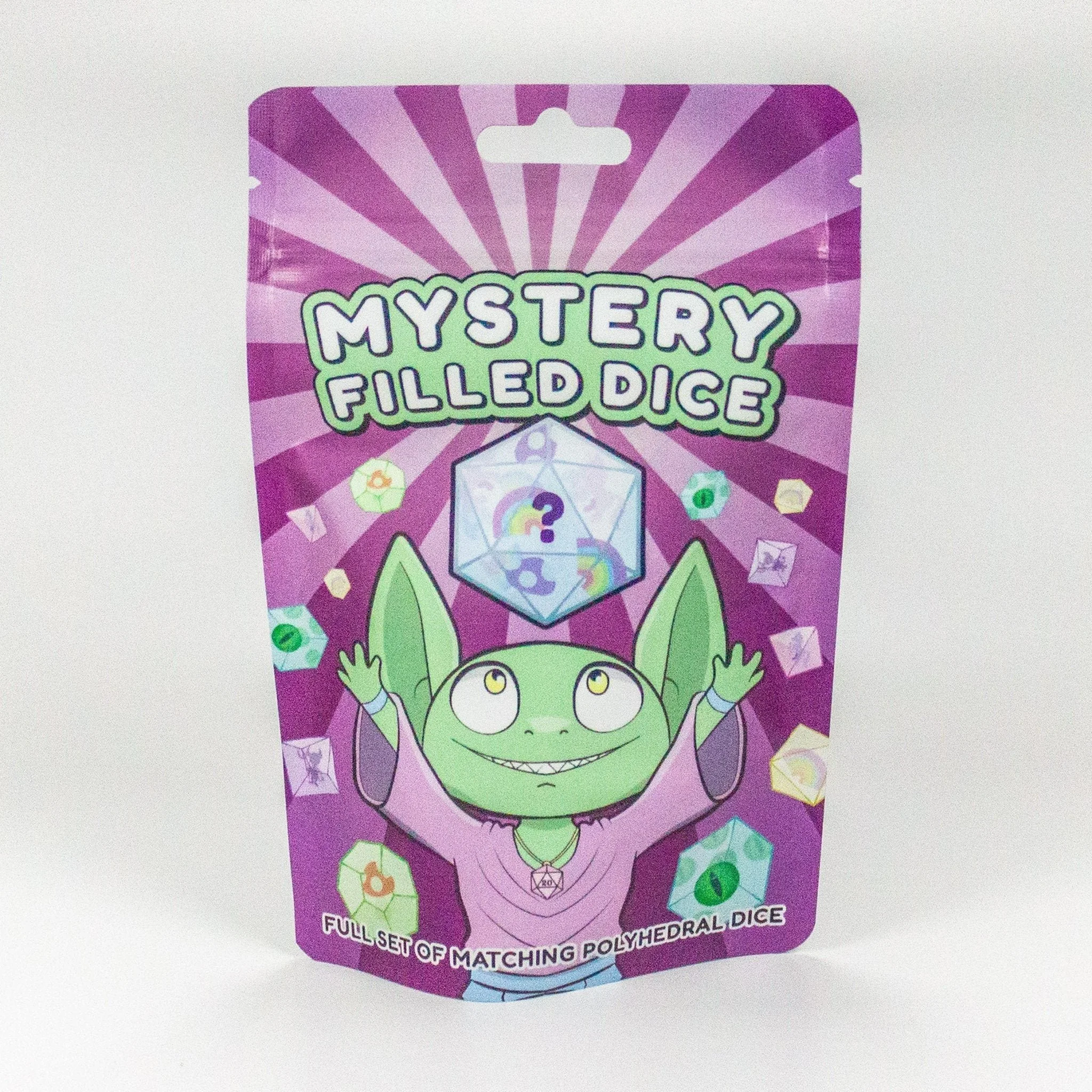 a package featuring a smiling green goblin with arms raised. Above him is a D20 dice with question marks on it. There are floating dice everywhere.The bag is purple.