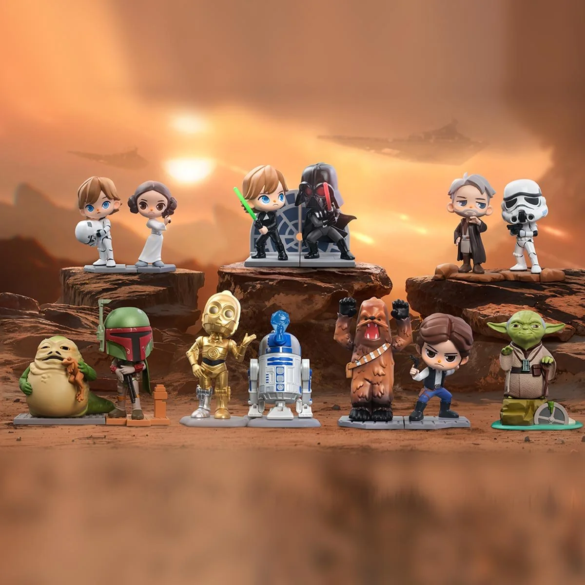 13 Star Wars figurines on tan, desert backdrop