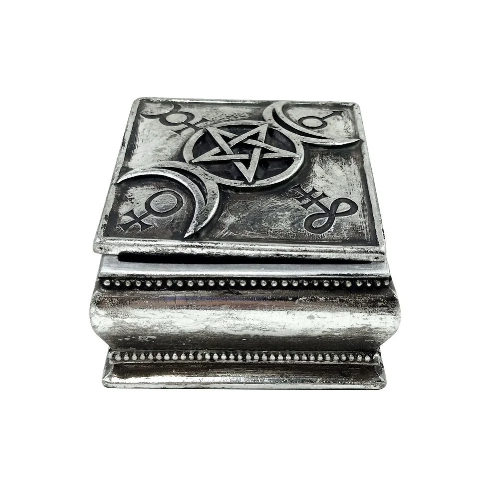 dull silver box with tapered base featuring wiccan symbology and slightly ajar lid.