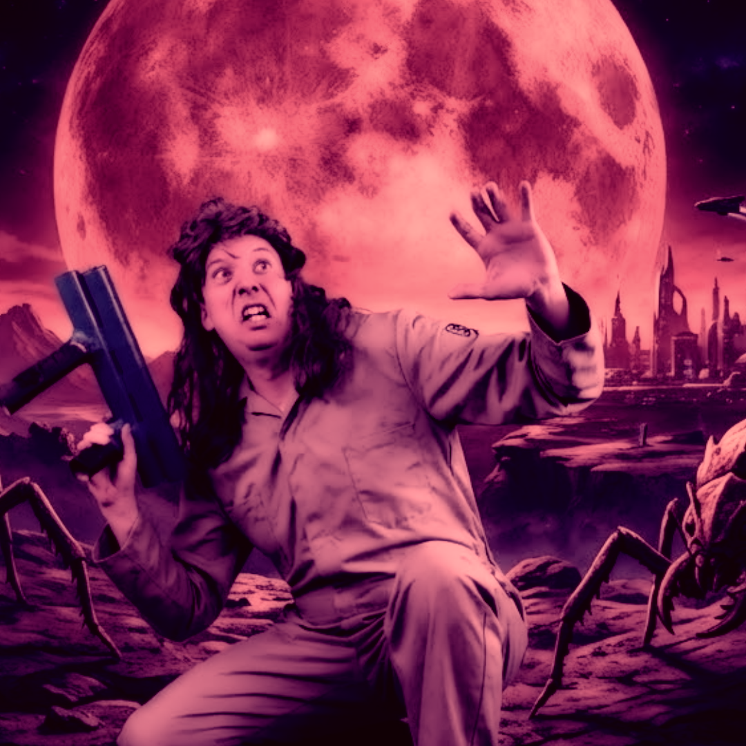 Dip Reinegger in a desert landscape with large spiders and a futuristic city skyline under a pink moon.