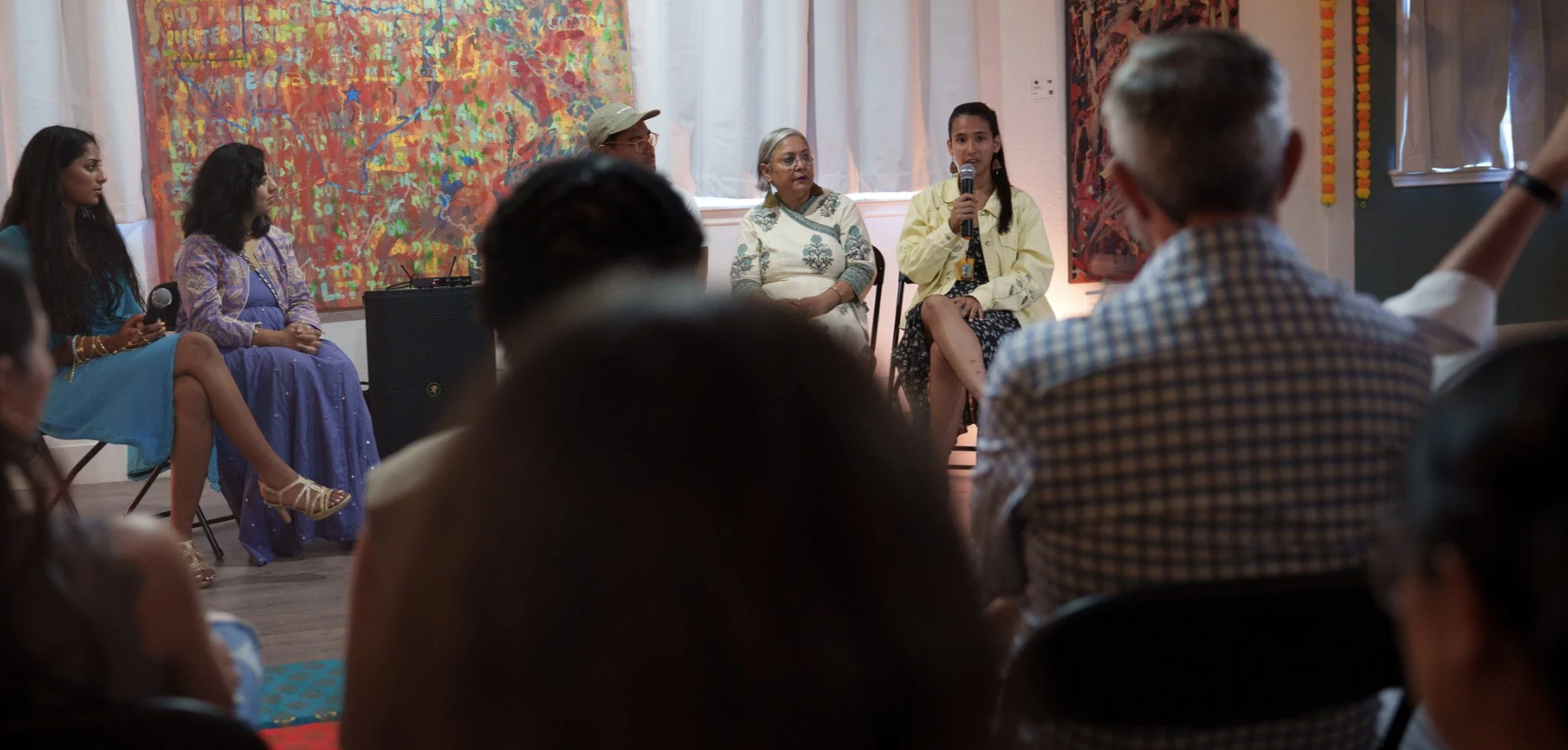 Alexia Leclercq speaking at a panel for OF Color Art show