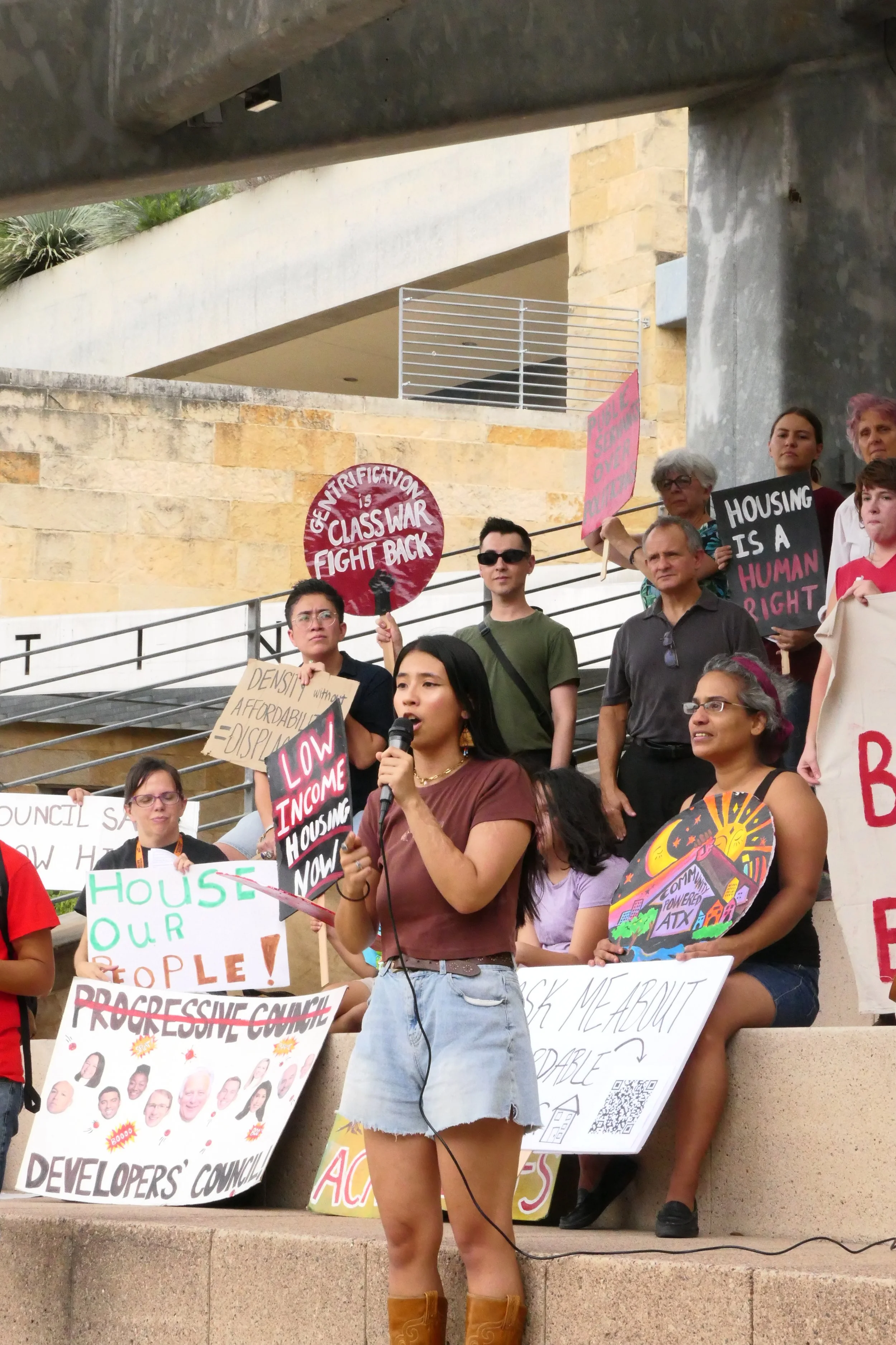 Alexia Leclercq speaking at Austin City Hall on housing justice