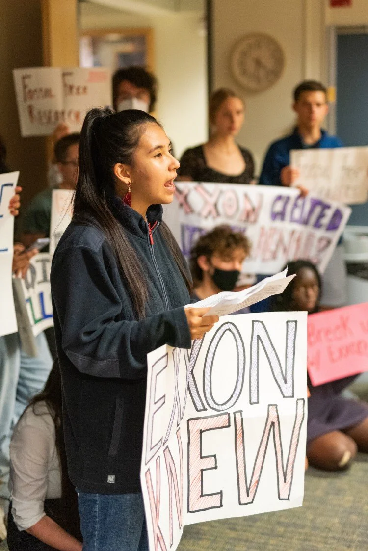 Alexia Leclercq speaking at a protest against Exxon Mobile