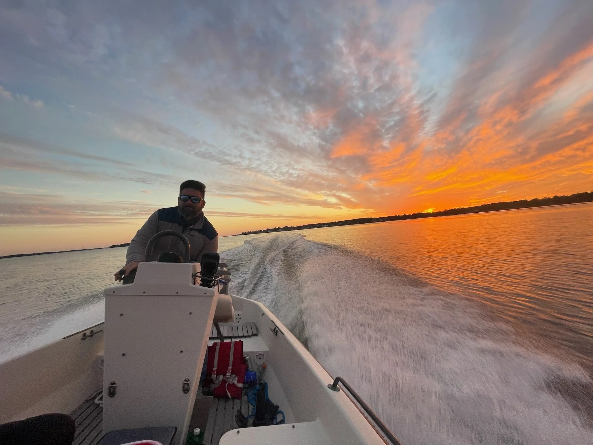 Captain Seth Daniel during a sunset tour on White Oak River.