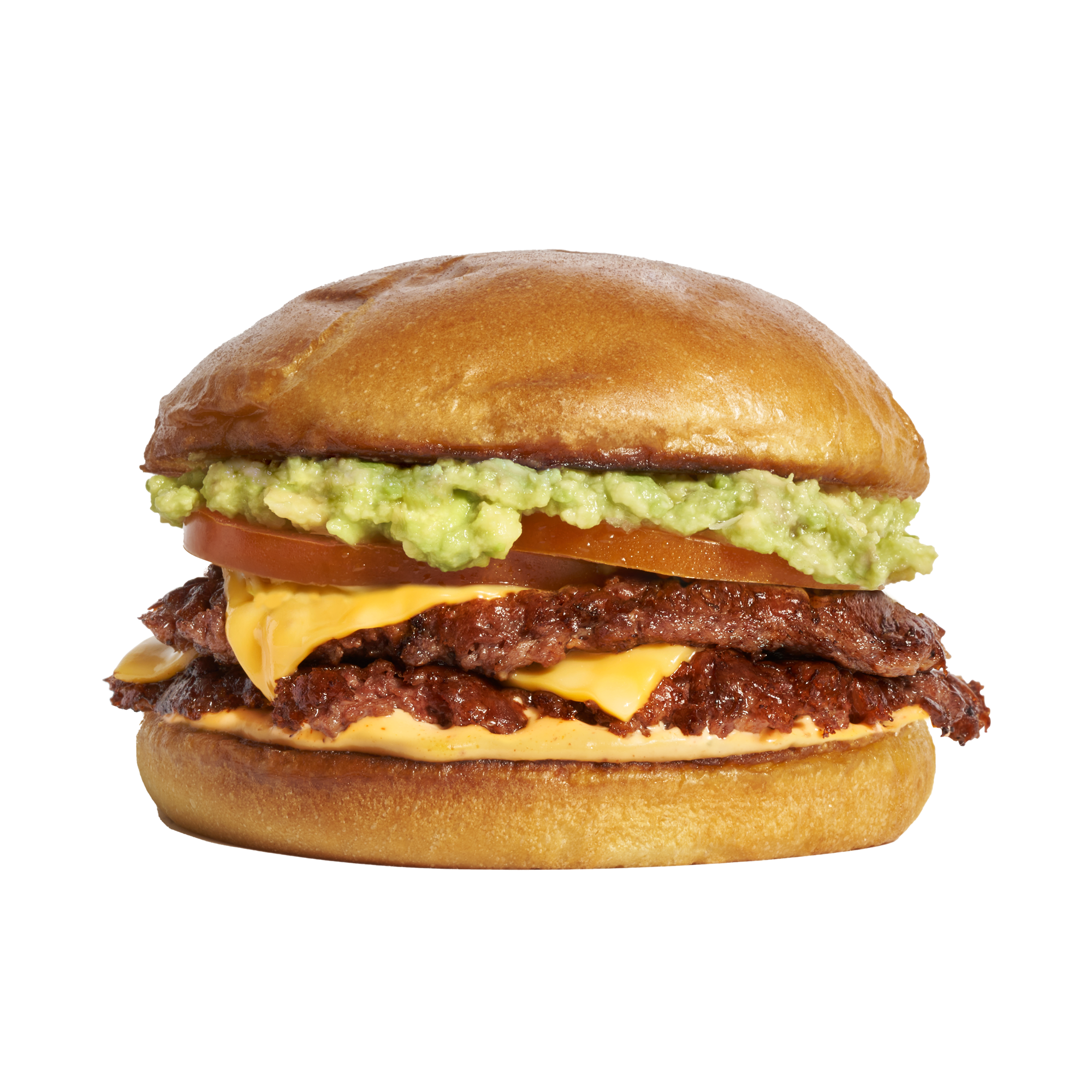 Close-up of a cheeseburger with beef patties, cheese, tomato, guacamole, and a soft bun.