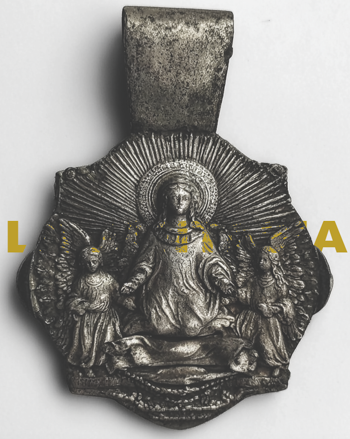 A religious metal medallion featuring a central figure of a woman with a halo, flanked by two angels, with the words "LATINA" overlaid in yellow.