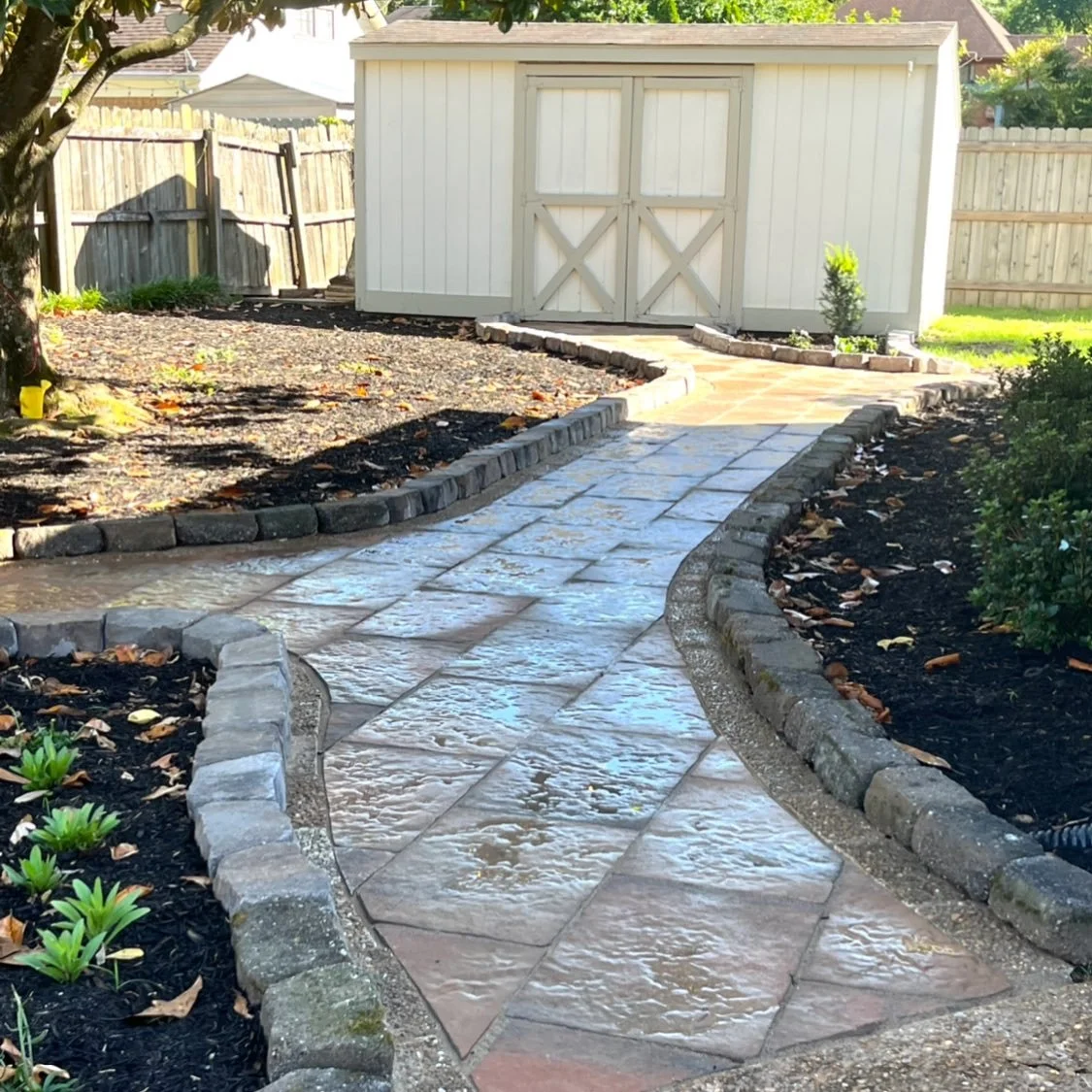 Creative solution: solving drainage issues with a walkway? That&rsquo;s right.
Shade, erosion, and downspouts caused this area of the yard to hold standing water. With no major slope to work with, most landscapers would immediately suggest a French d