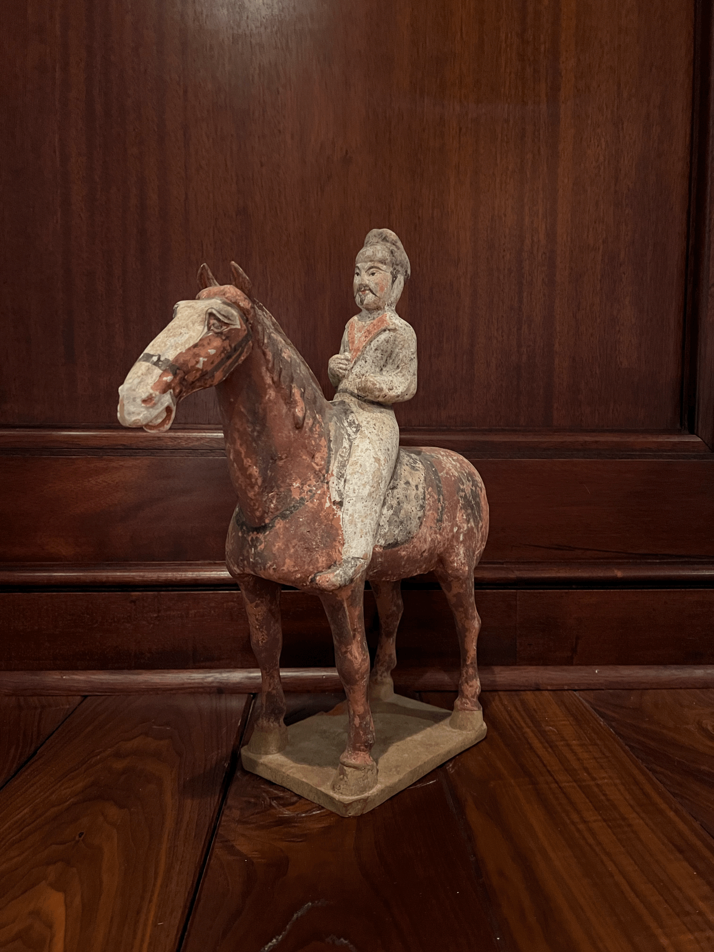 A Chinese Polychrome Painted Pottery Figure of an Equestrian