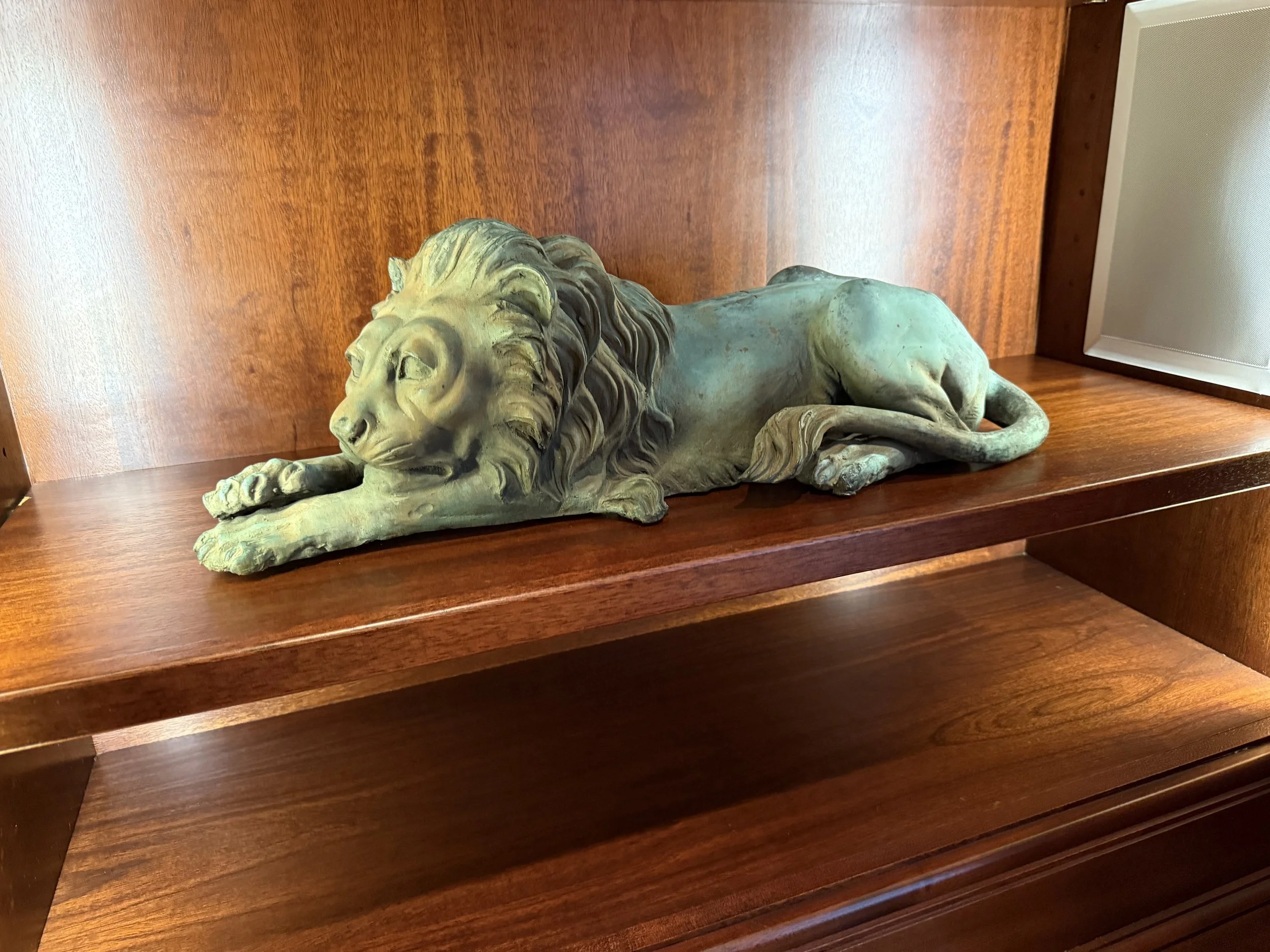 Pair of patinated bronze recumbent Canova style lions