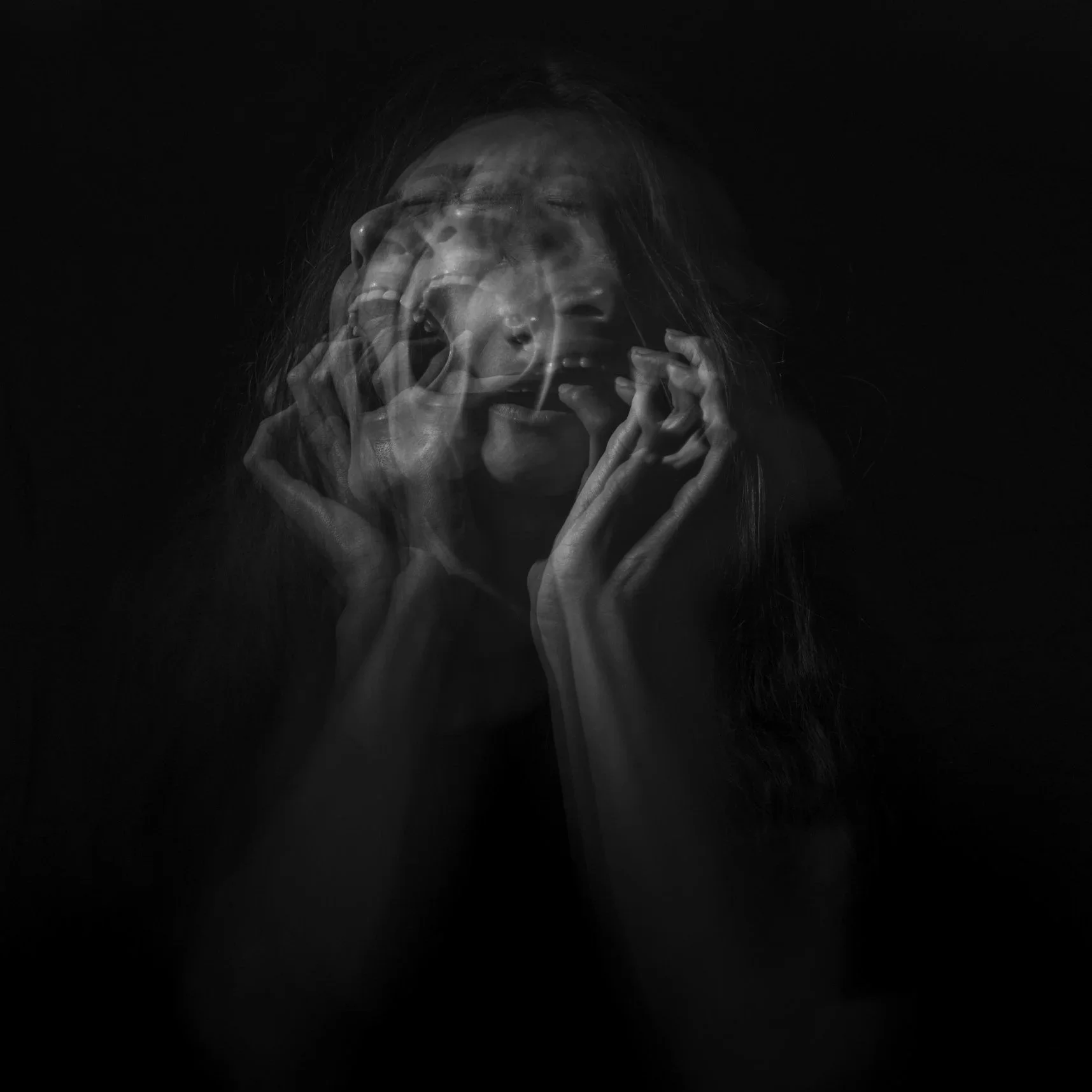 Black and white photo of a woman showing multiple overlapping expressions of distress and anguish, with hands near her face on a dark background.