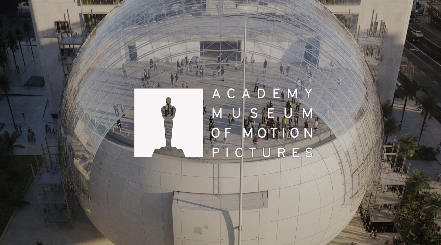 Aerial view of the Academy Museum of Motion Pictures with a glass domed rooftop and people walking inside and outside the building.