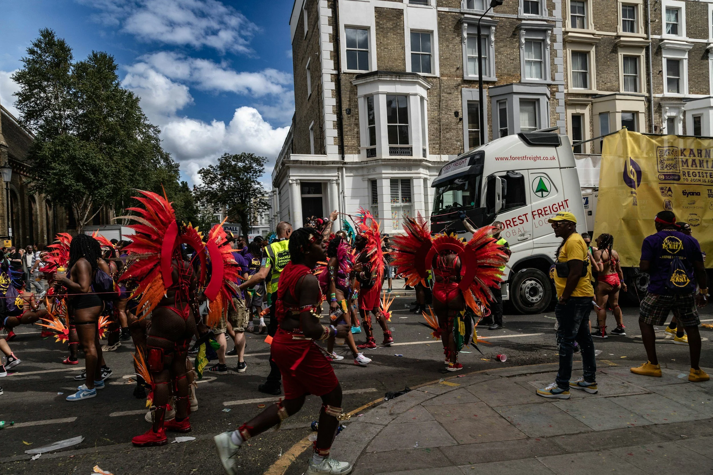 People in vibrant costimes at Notting Hill Carnival