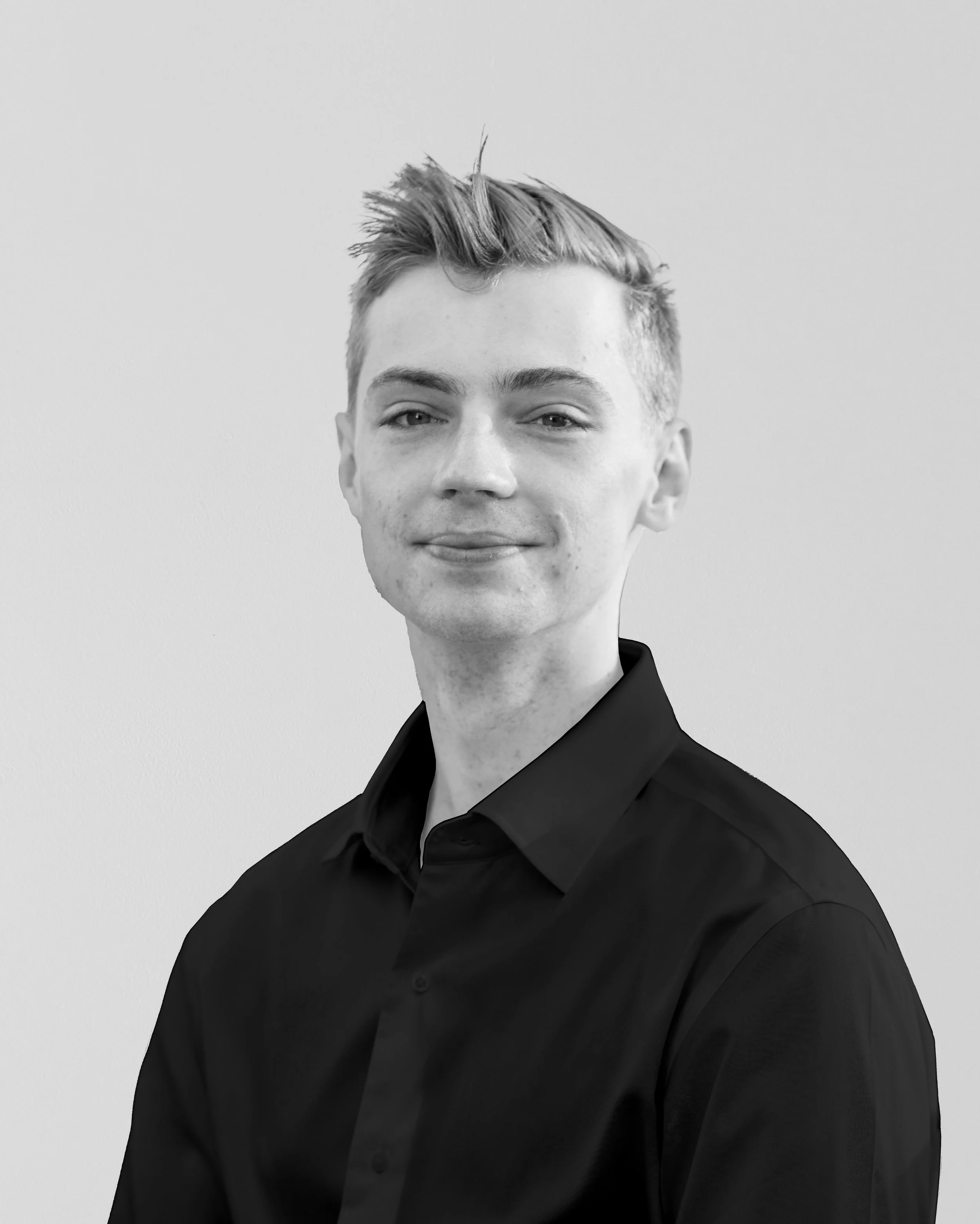 Black and white portrait of Associate Liam Larman