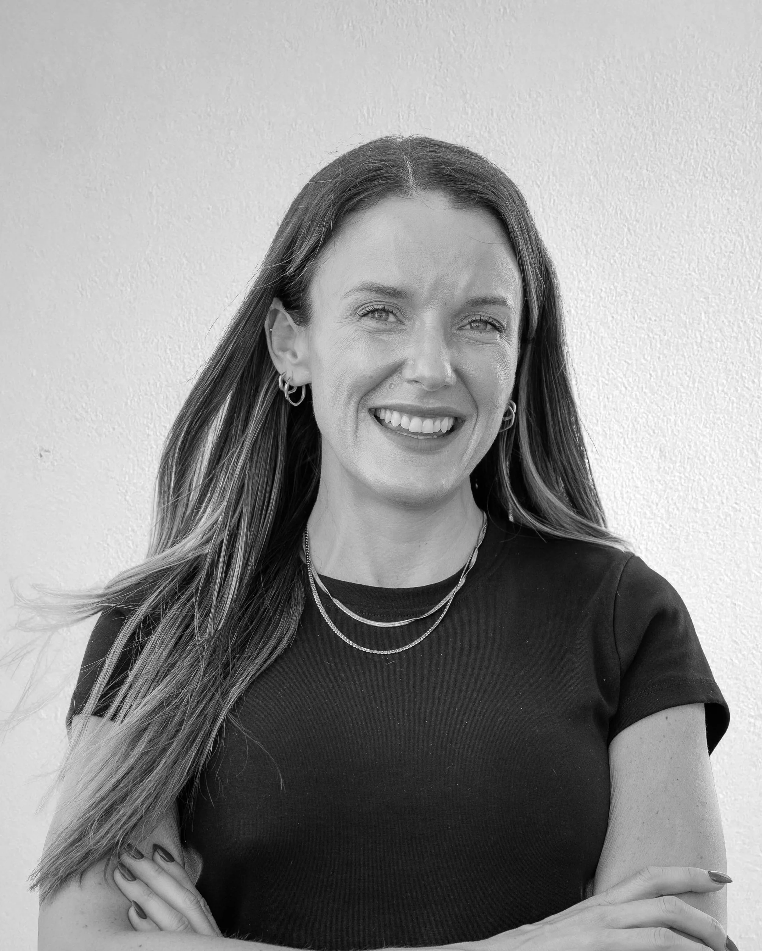 Black and white portrait of Senior Cost Estimator Paige Coughlin
