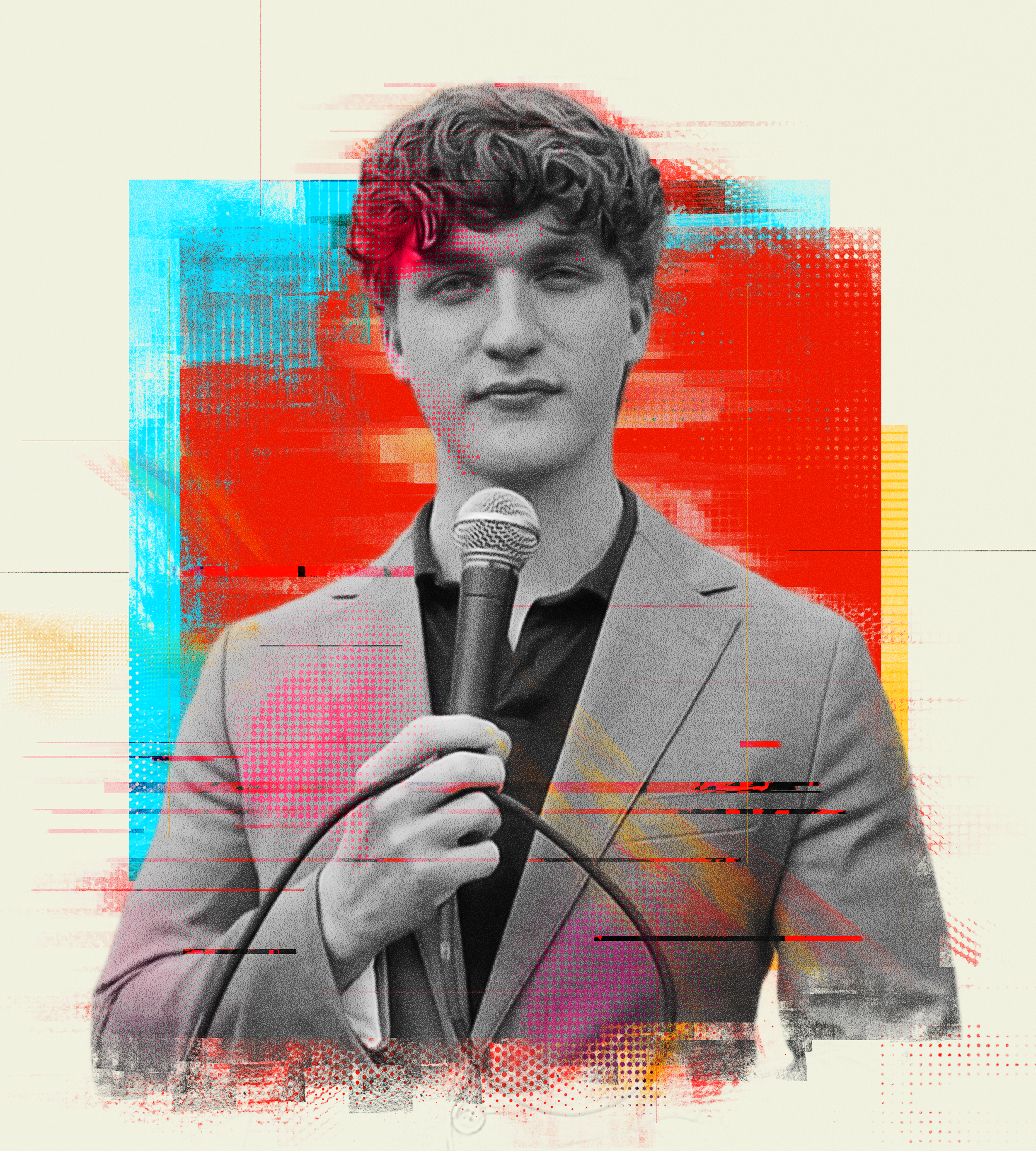 Luke Beasley in a suit holds a microphone, speaking during an event with abstract, colorful background elements.