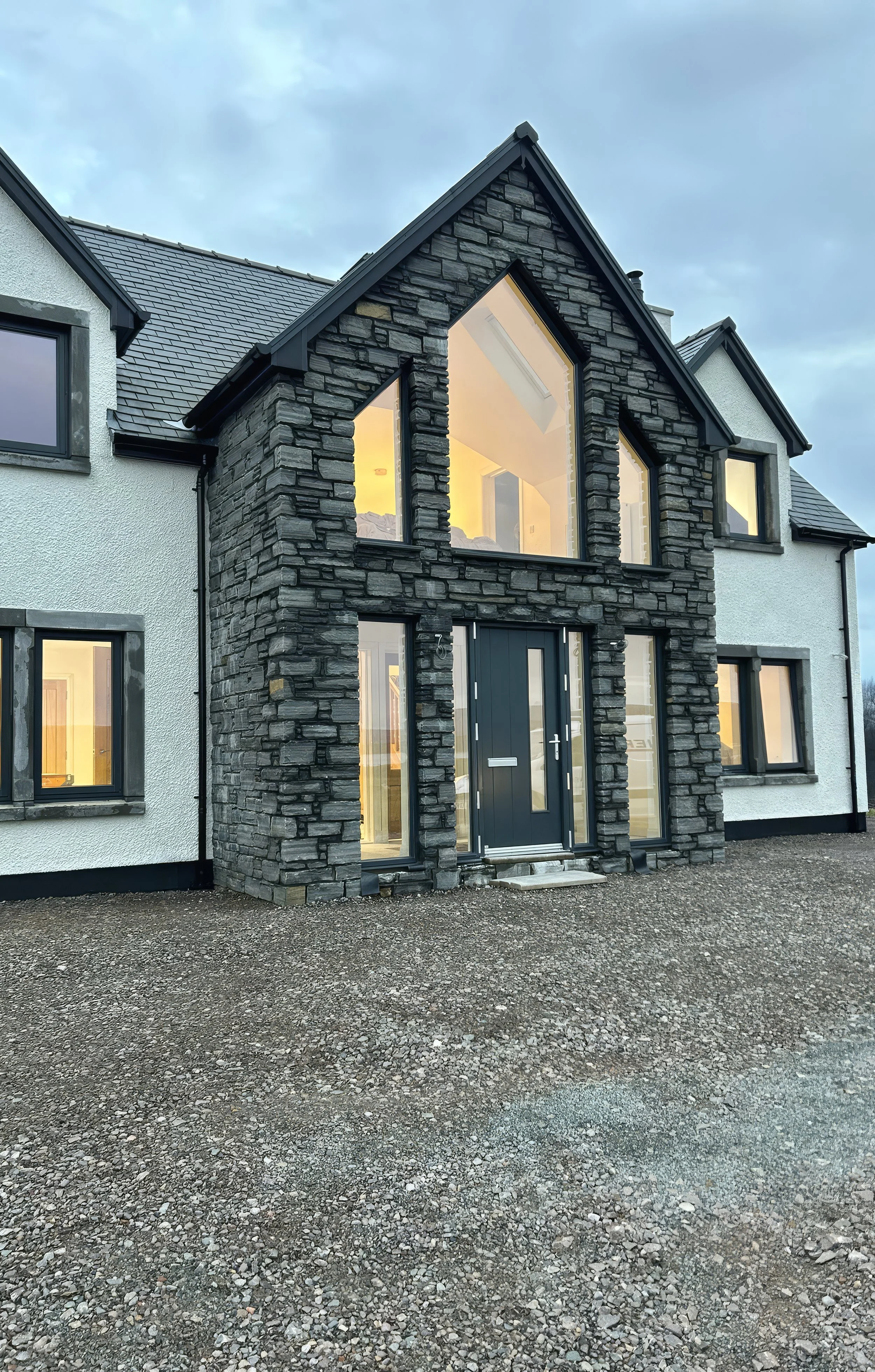 Modern house with dark stonemasonry accents. Scotland
