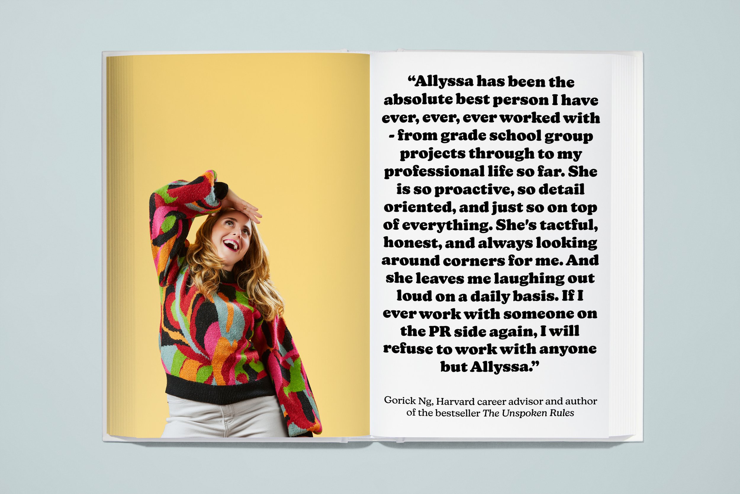 Open book with a photo of a woman with light brown hair wearing a colorful abstract patterned sweater, smiling and looking upwards, on the left page; on the right page, a quote praising Allyssa, attributed to Gorick Ng, with a white background and bl