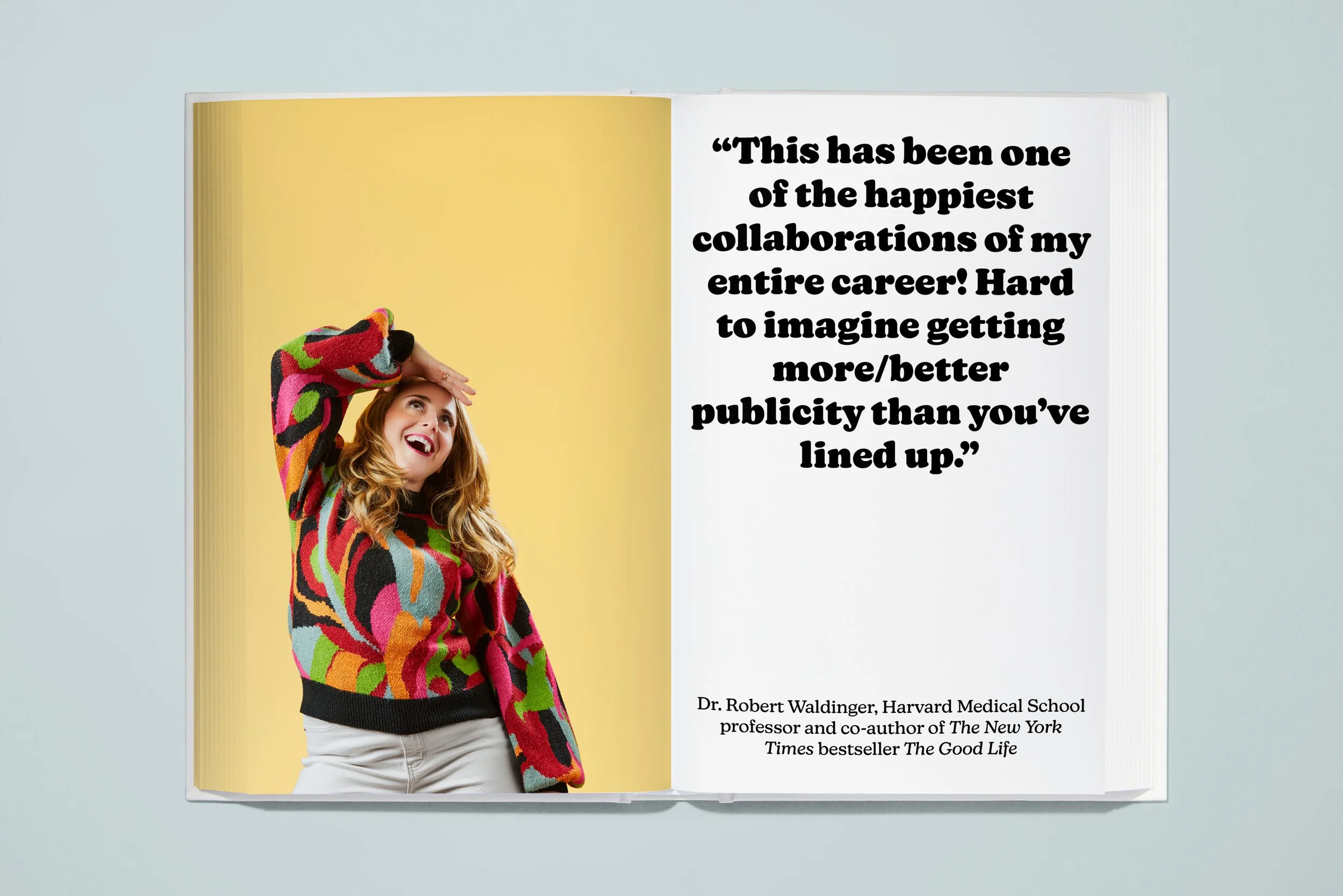An open magazine with a smiling woman wearing a colorful sweater on the left page and a quote on the right page that reads, "This has been one of the happiest collaborations of my entire career! Hard to imagine getting more/better publicity than you'