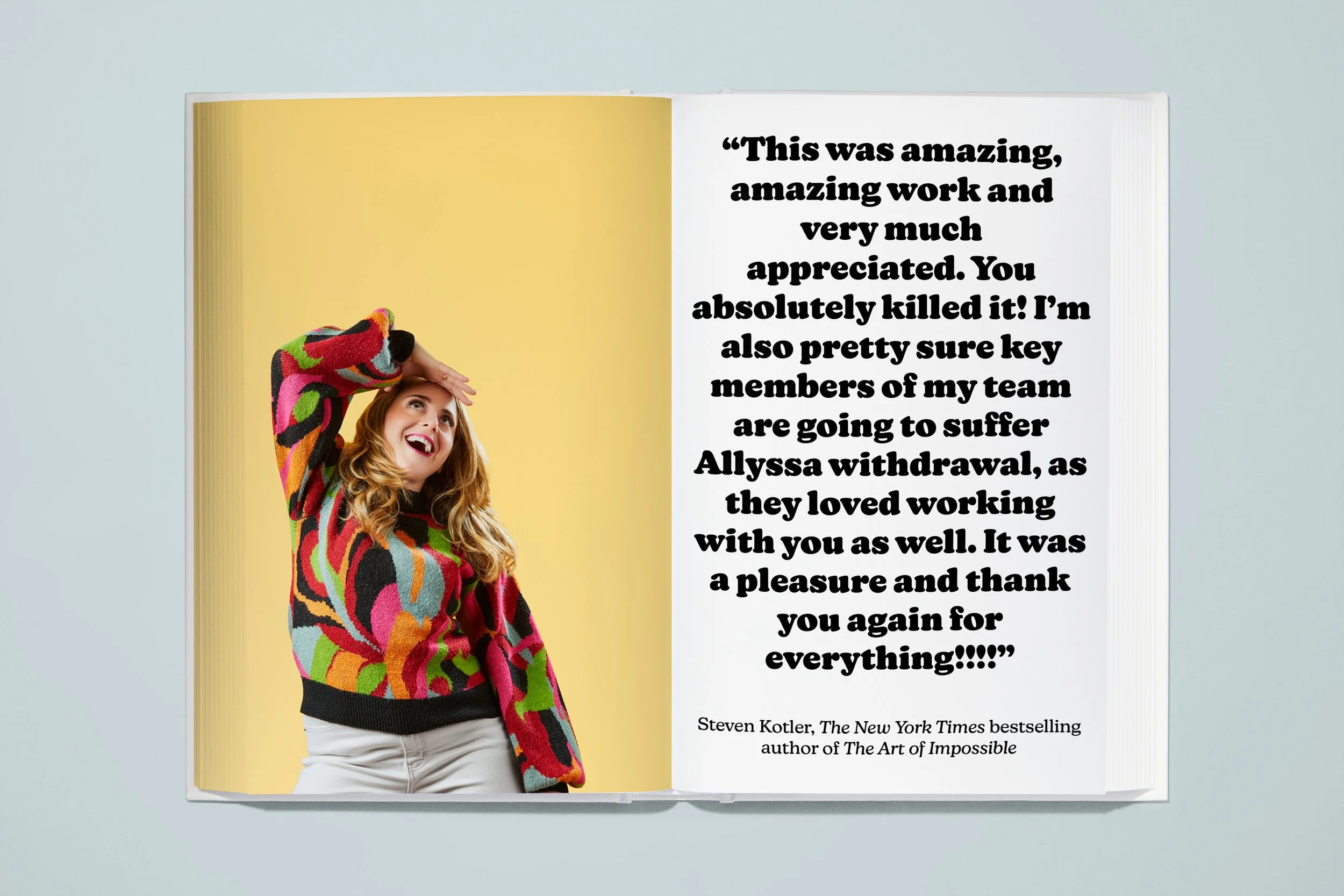 Open book featuring a photograph of a woman with wavy, shoulder-length hair, wearing a multicolored abstract patterned sweater, standing against a yellow background on the left page. On the right page, a quote in large, bold black font reads: "This w
