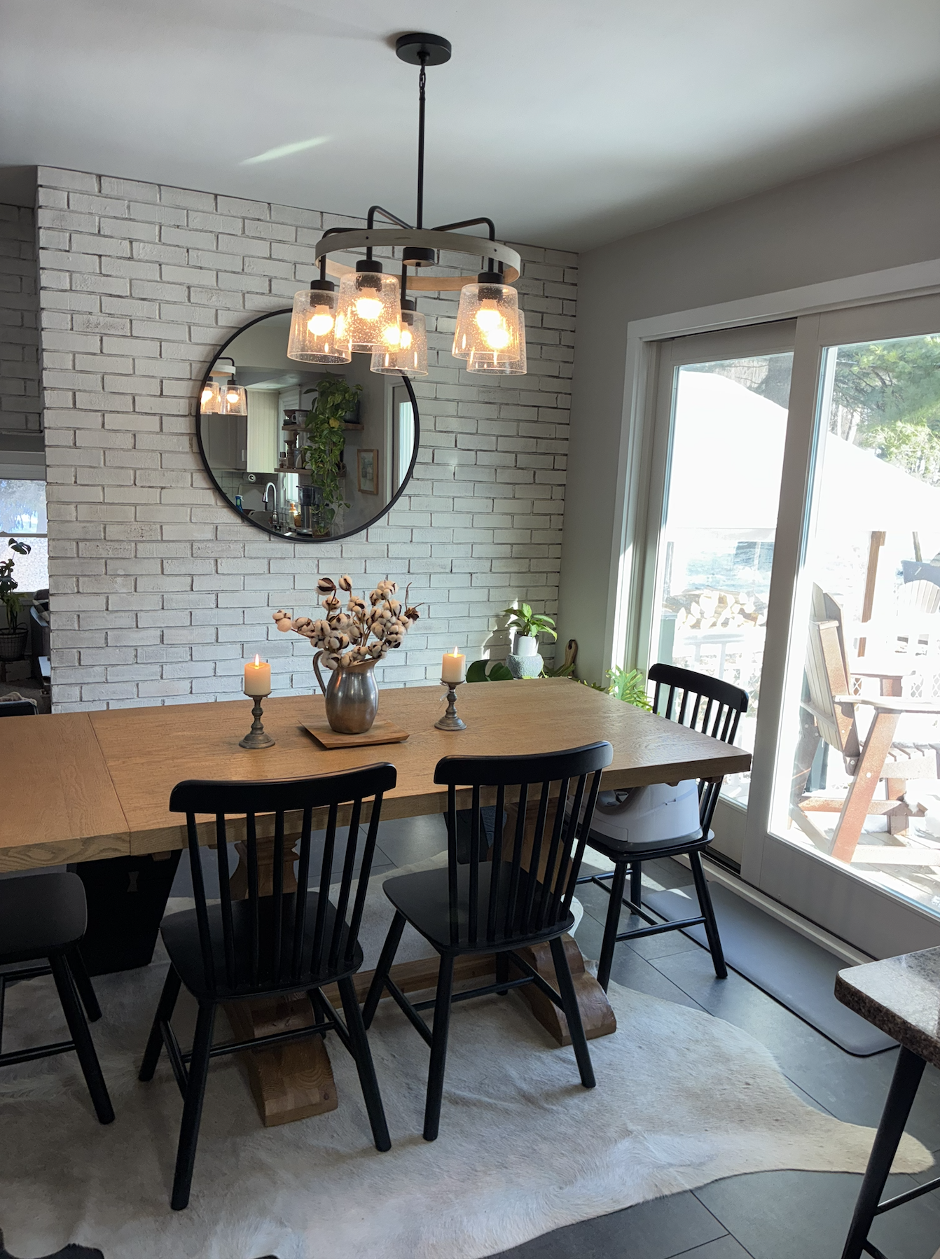 Dining room refinished with a newly installed sliding glass door, refinished brick and updated flooring.