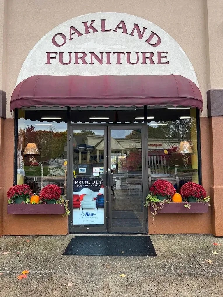 Front entrance of Oakland Furniture in Oakland, Maine, showing the main doors where customers enter the showroom.