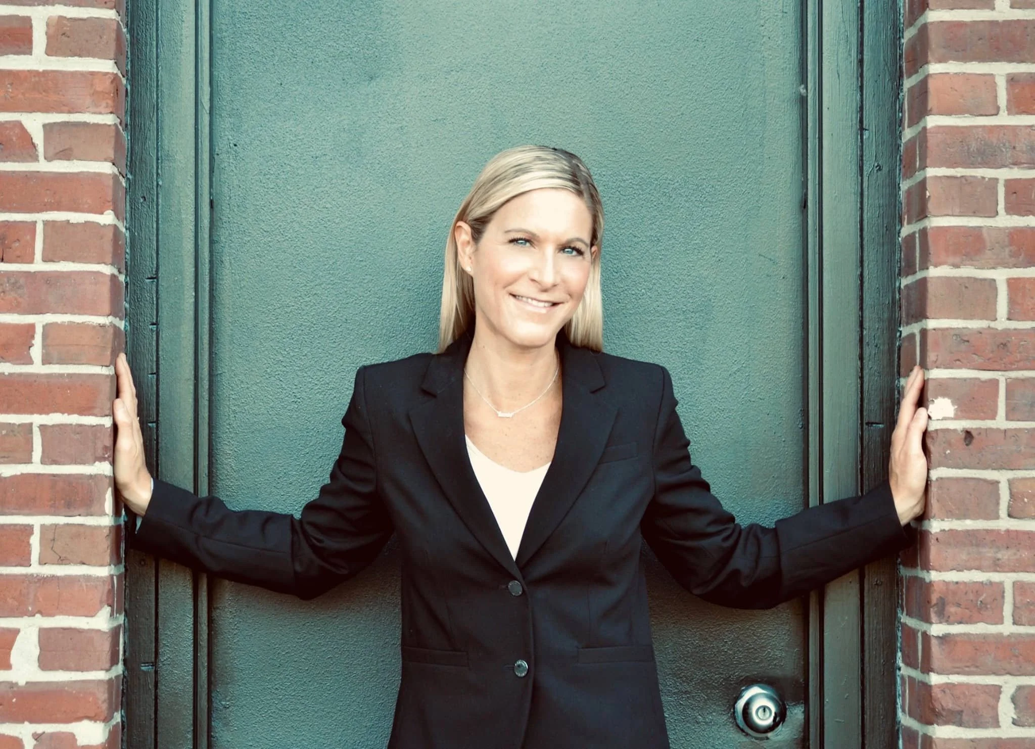 Portrait of Oakland Furniture owner, Kelly Breton, representing personalized service and a people-first approach.