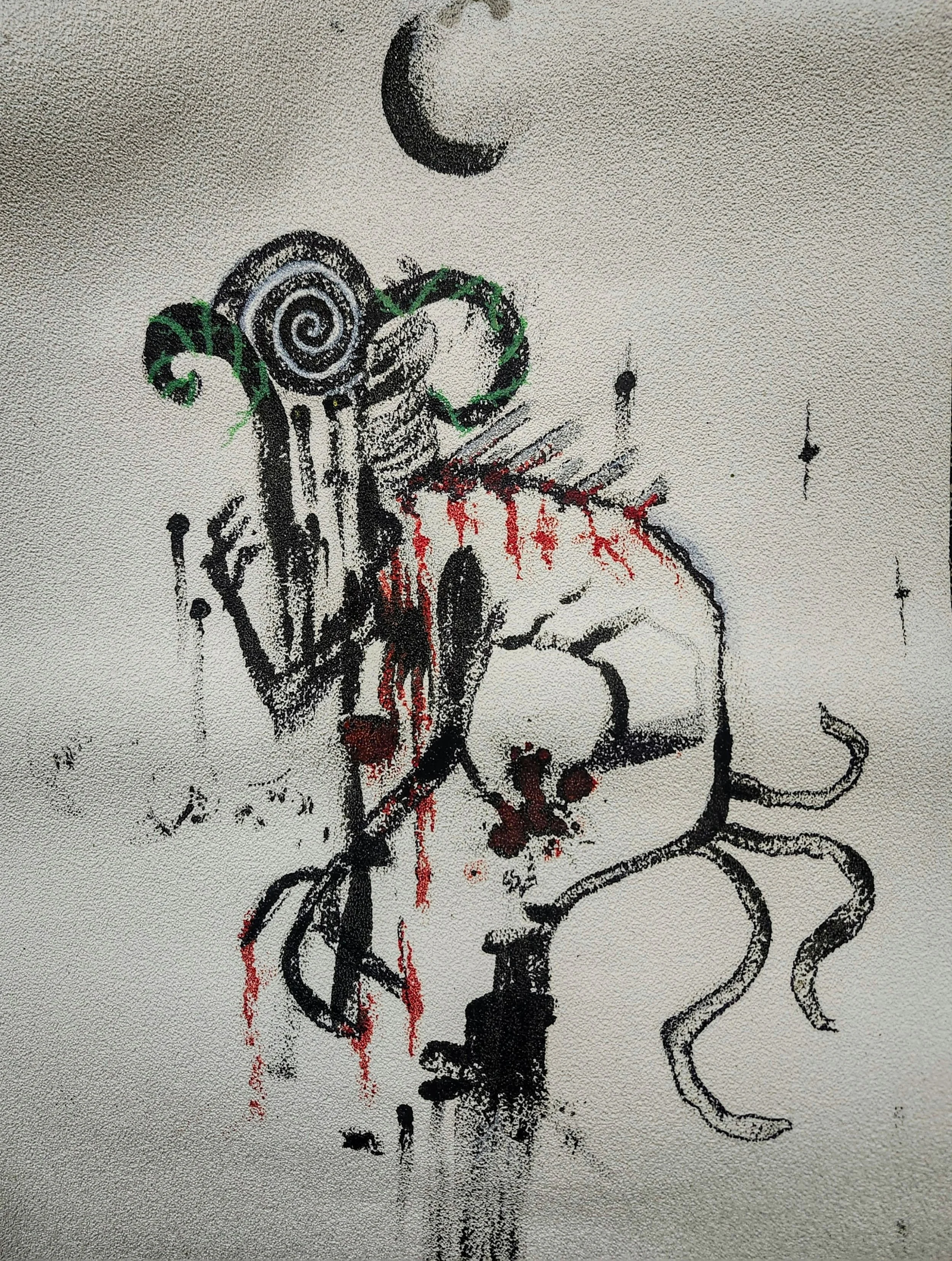 Street art depicting a humanoid figure with machine-like features, blood-red drips, tentacles, and a crescent moon in the background.