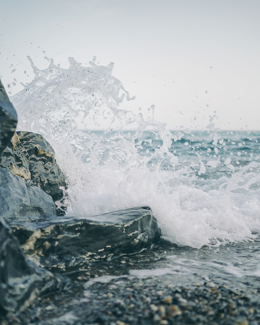 Waves crashing against rocks at the shoreline