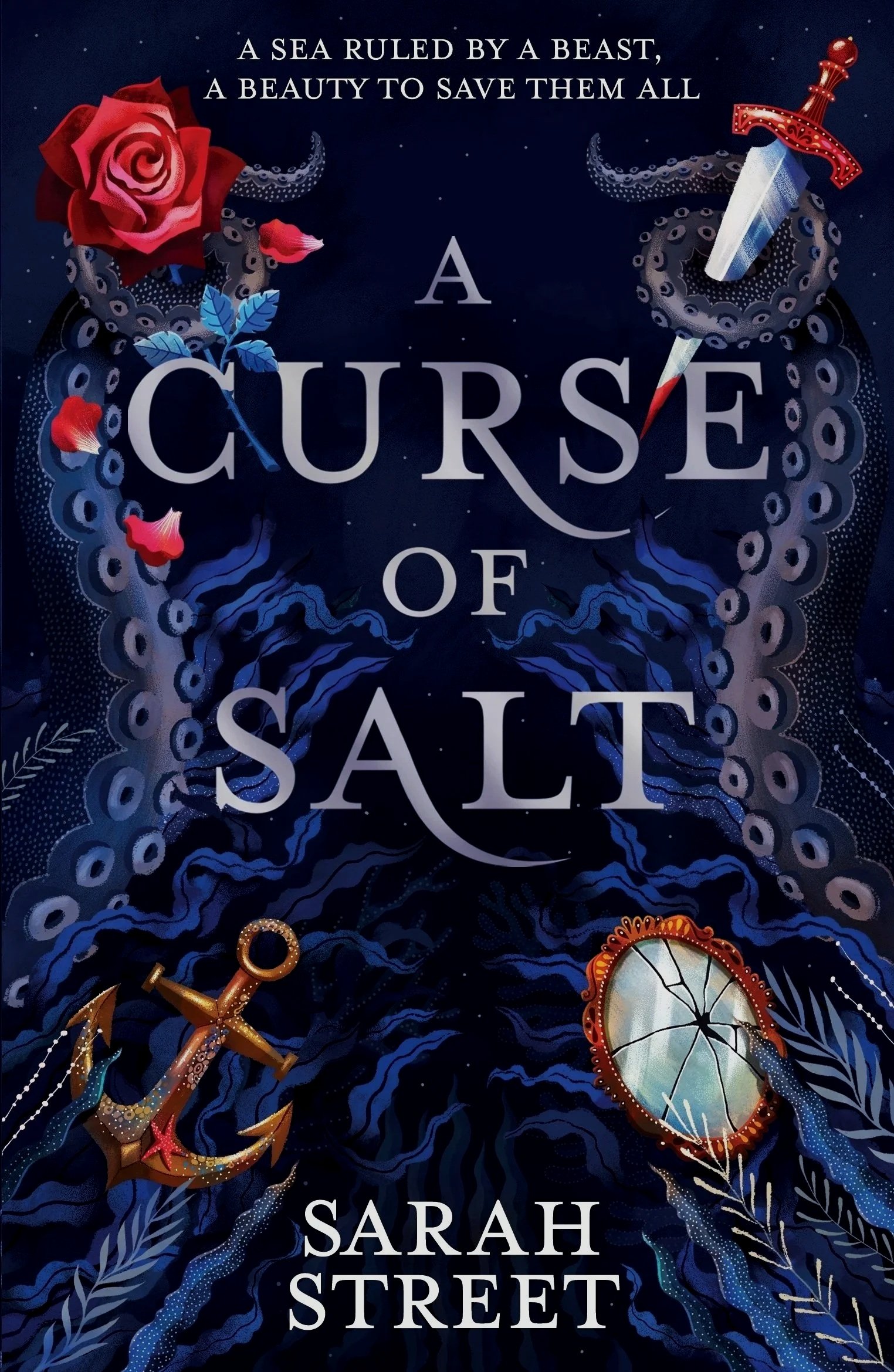 The book cover of 'A Curse of Salt', with a dark blue background, a large red rose and flower petals, a dagger with a red handle, an anchor, a broken mirror, and the tagline 'A sea ruled by a beast, a beauty to save them all.'
