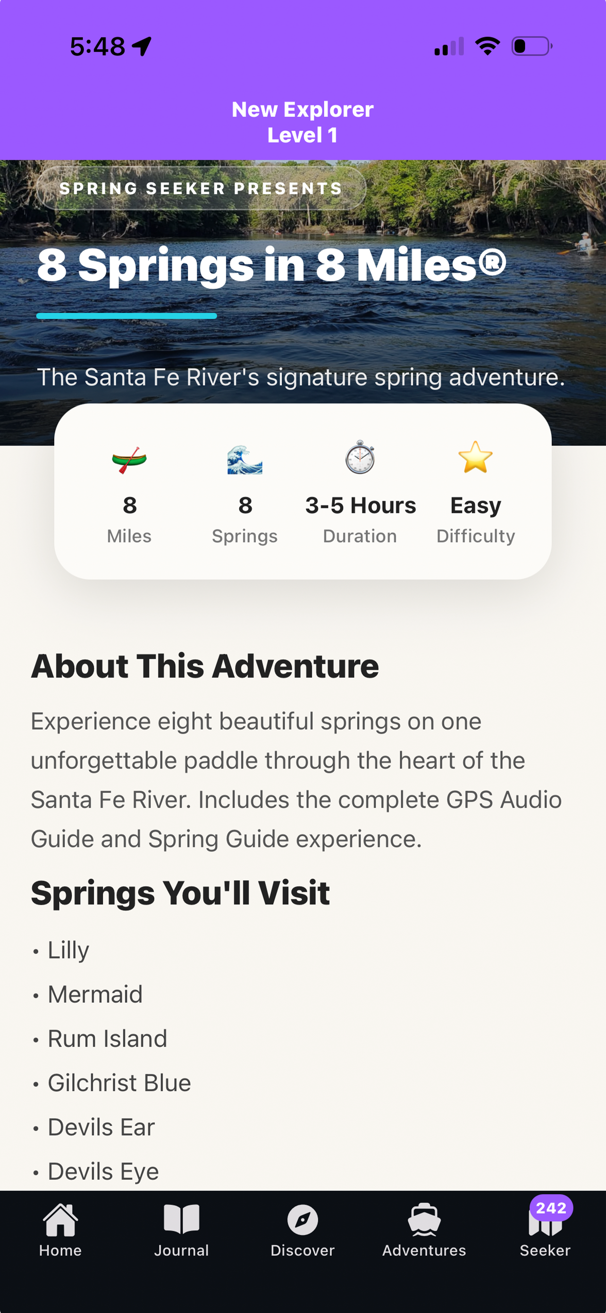 Mobile app screen promoting an outdoor adventure called "8 Springs in 8 Miles." The screen features a scenic river with trees on both sides, and information about the adventure including 8 miles, 8 springs, 3-5 hours duration, and easy difficulty. The app also lists springs to visit such as Lilly, Mermaid, Rum Island, Gilchrist Blue, Devils Ear, and Devils Eye. Navigation icons at the bottom include Home, Journal, Discover, Adventures, and Seeker with a notification badge showing 242.