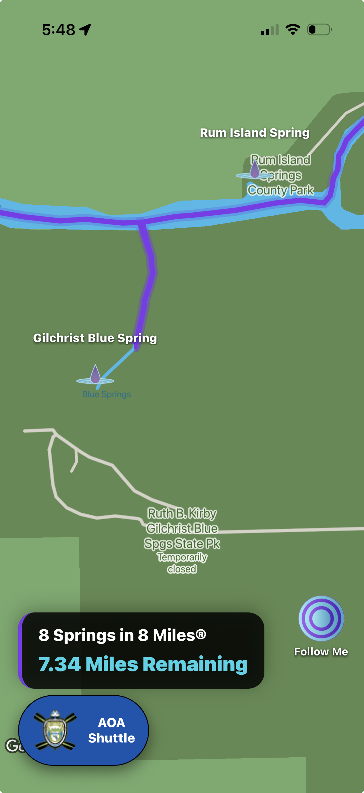 Map view showing locations of Blue Springs, Gilchrist Blue Spring, Rum Island Spring, and Rum Island County Park at Rum Island Spring. It displays a route between Blue Springs and Gilchrist Blue Spring, with a marker for an AOA Shuttle and a notification of 8 springs within 8 miles, with 7.34 miles remaining.