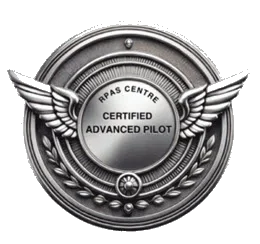 A metal badge with wings and a circular center that says "RAPS Centre Certified Advanced Pilot."