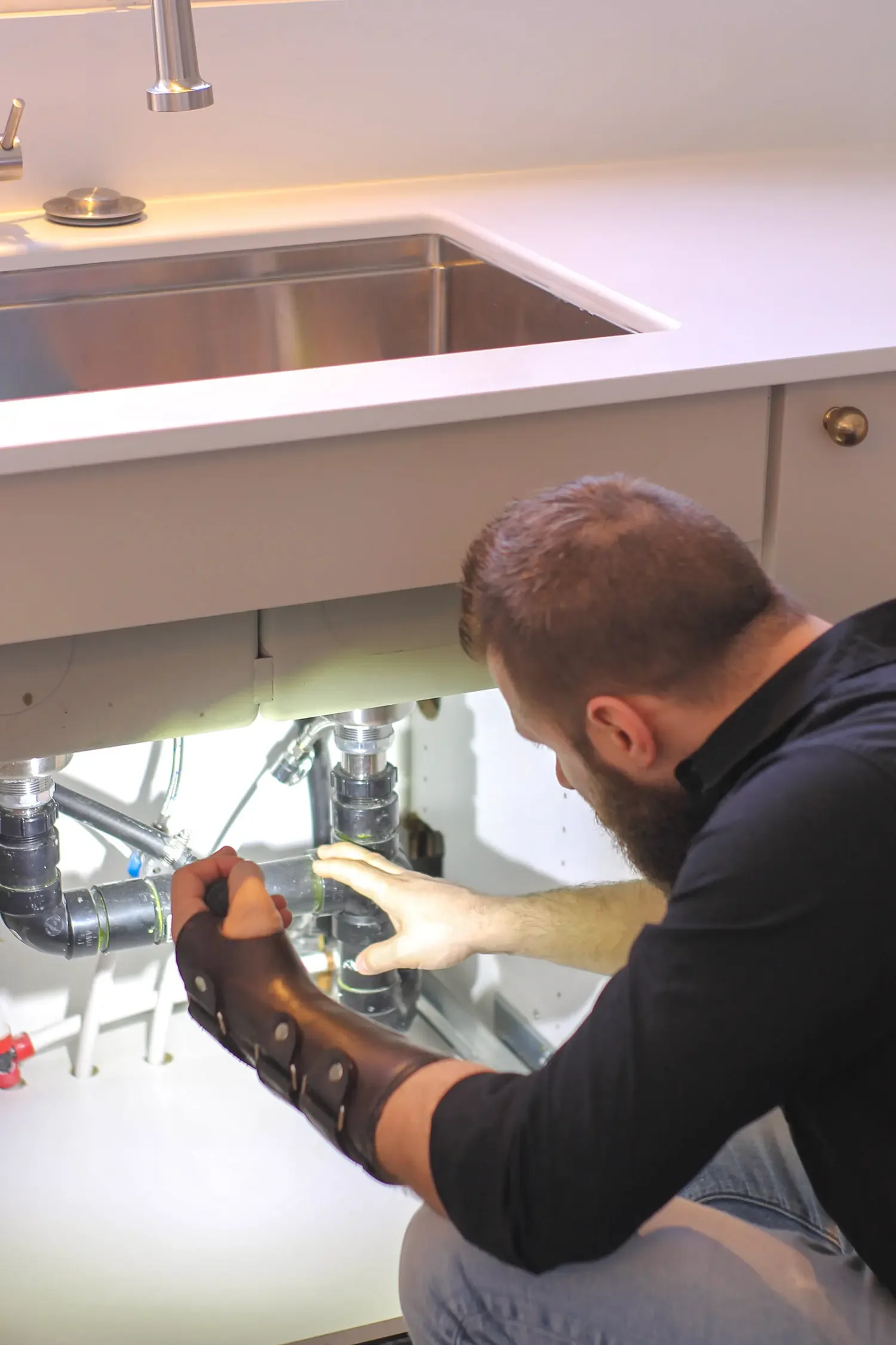 Heritage Home Inspector Examining Plumbing During an Inspection