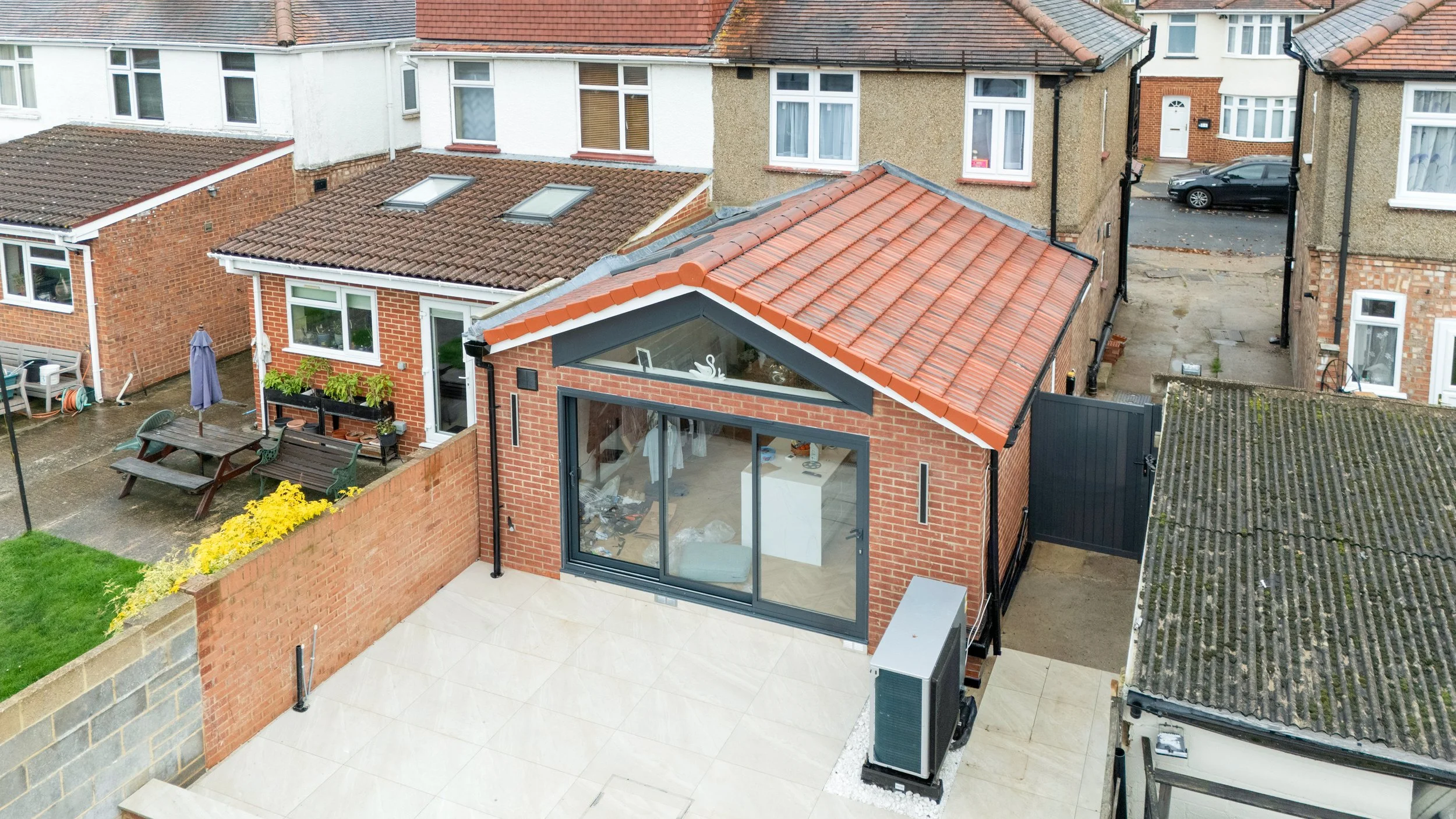 Single storey rear and front porch extensions to semi-detached house in West London
