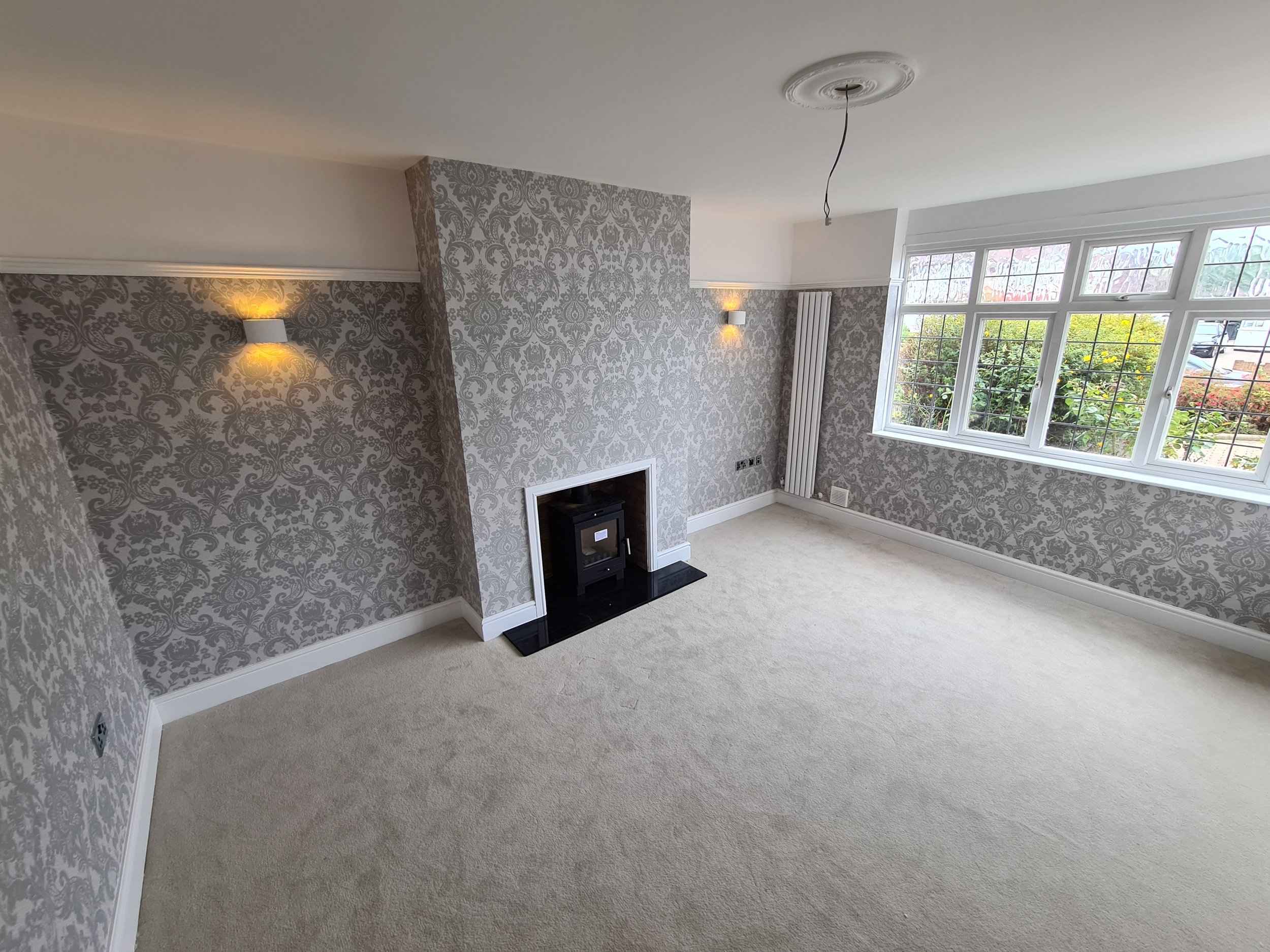 Single storey rear extension and garage conversion to semi-detached house in Surrey