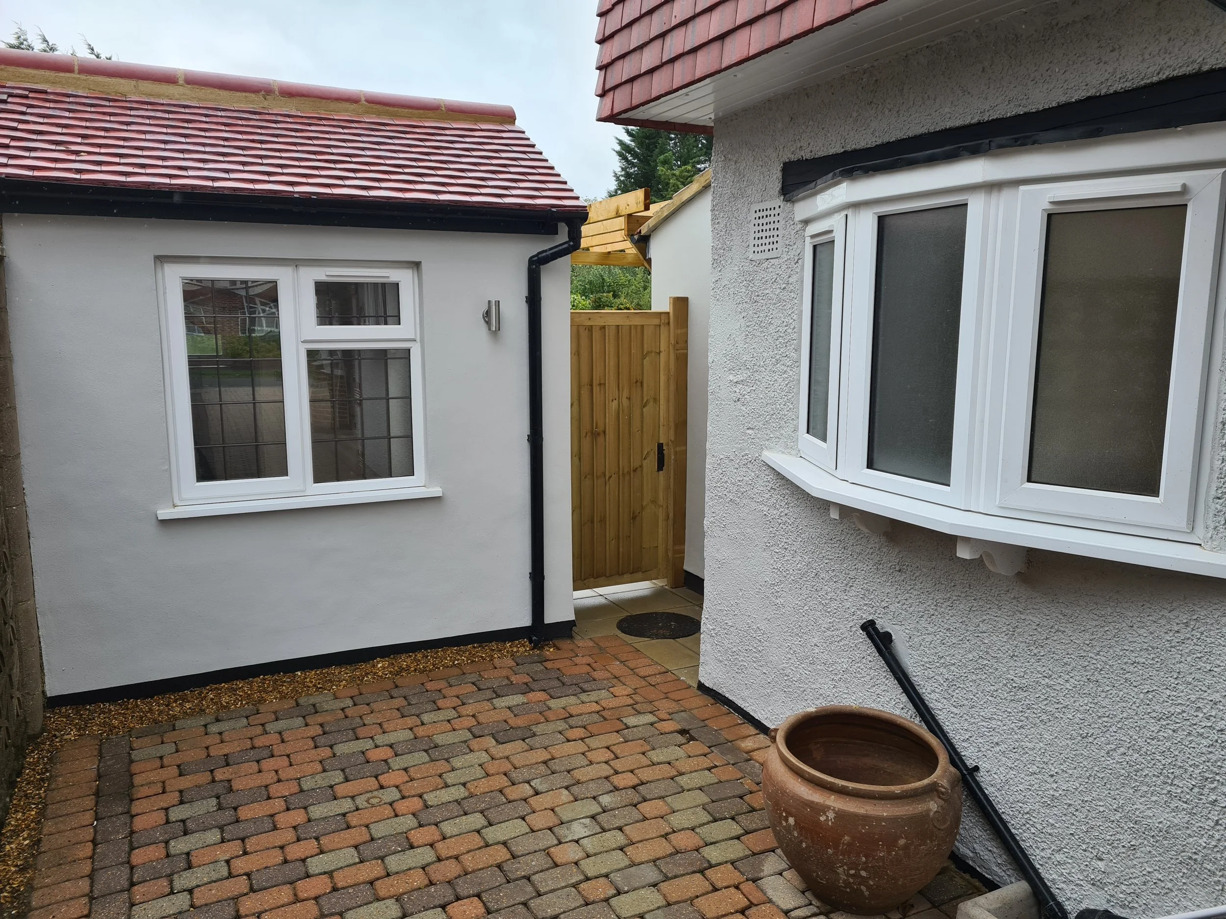 Single storey rear extension and garage conversion to semi-detached house in Surrey