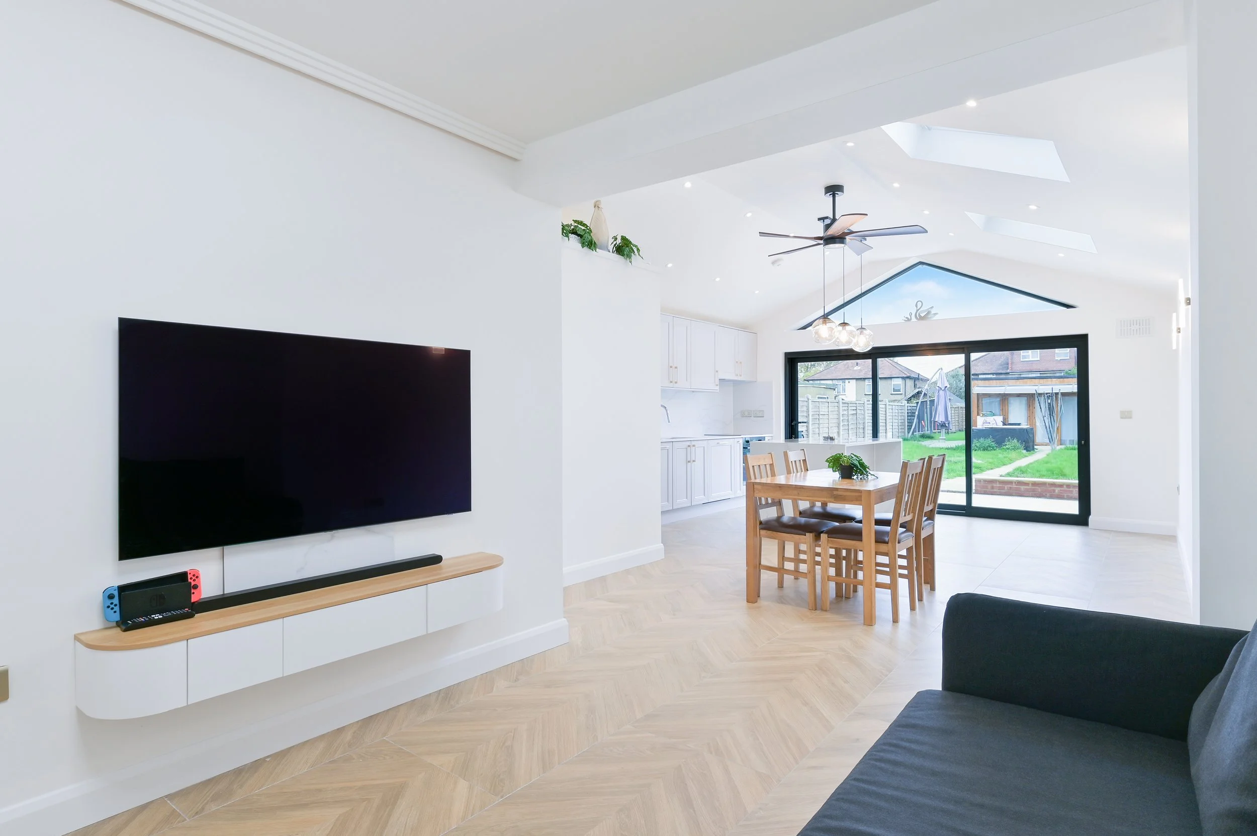 Single storey rear and front porch extensions to semi-detached house in West London