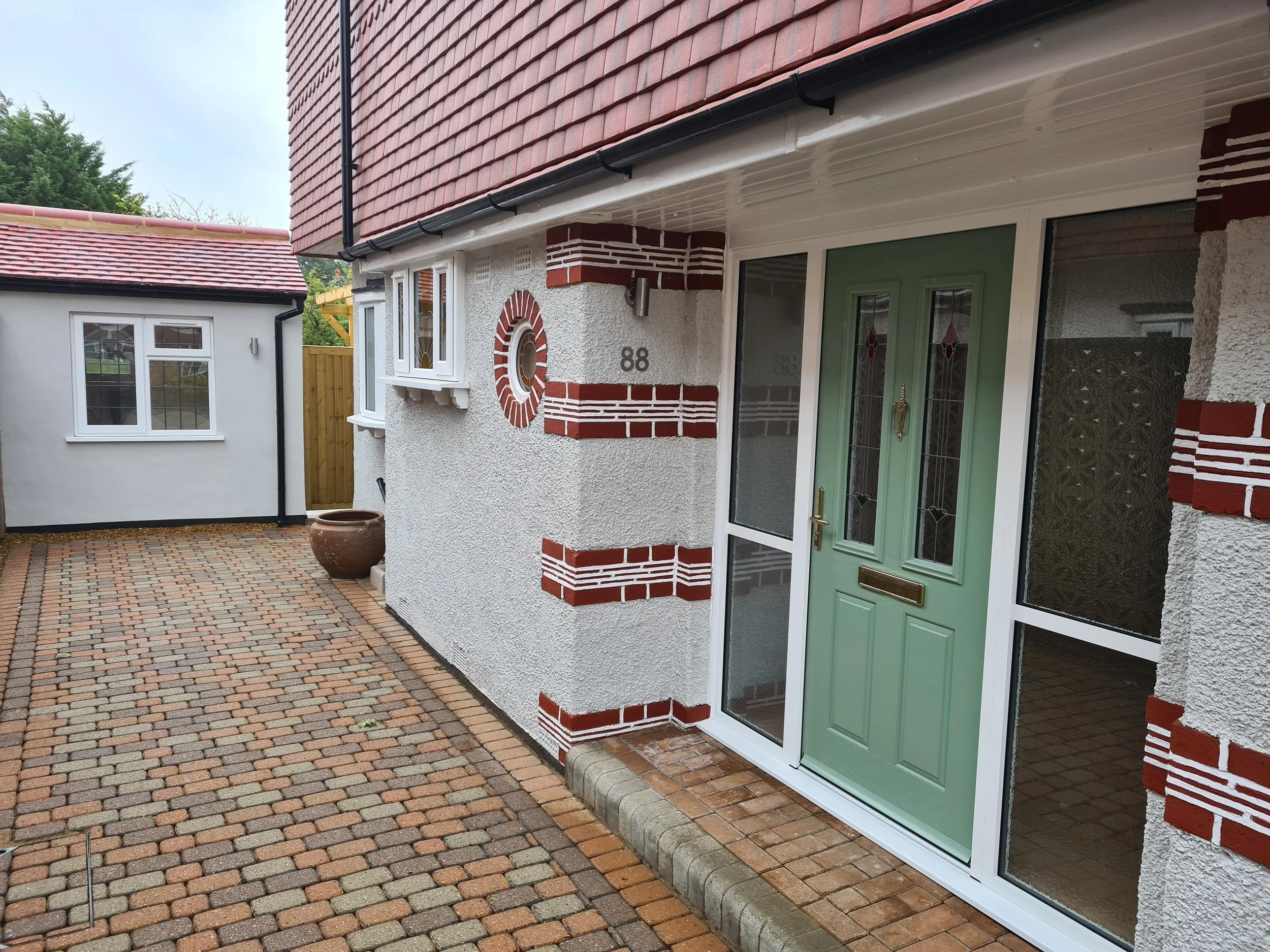 Single storey rear extension and garage conversion to semi-detached house in Surrey