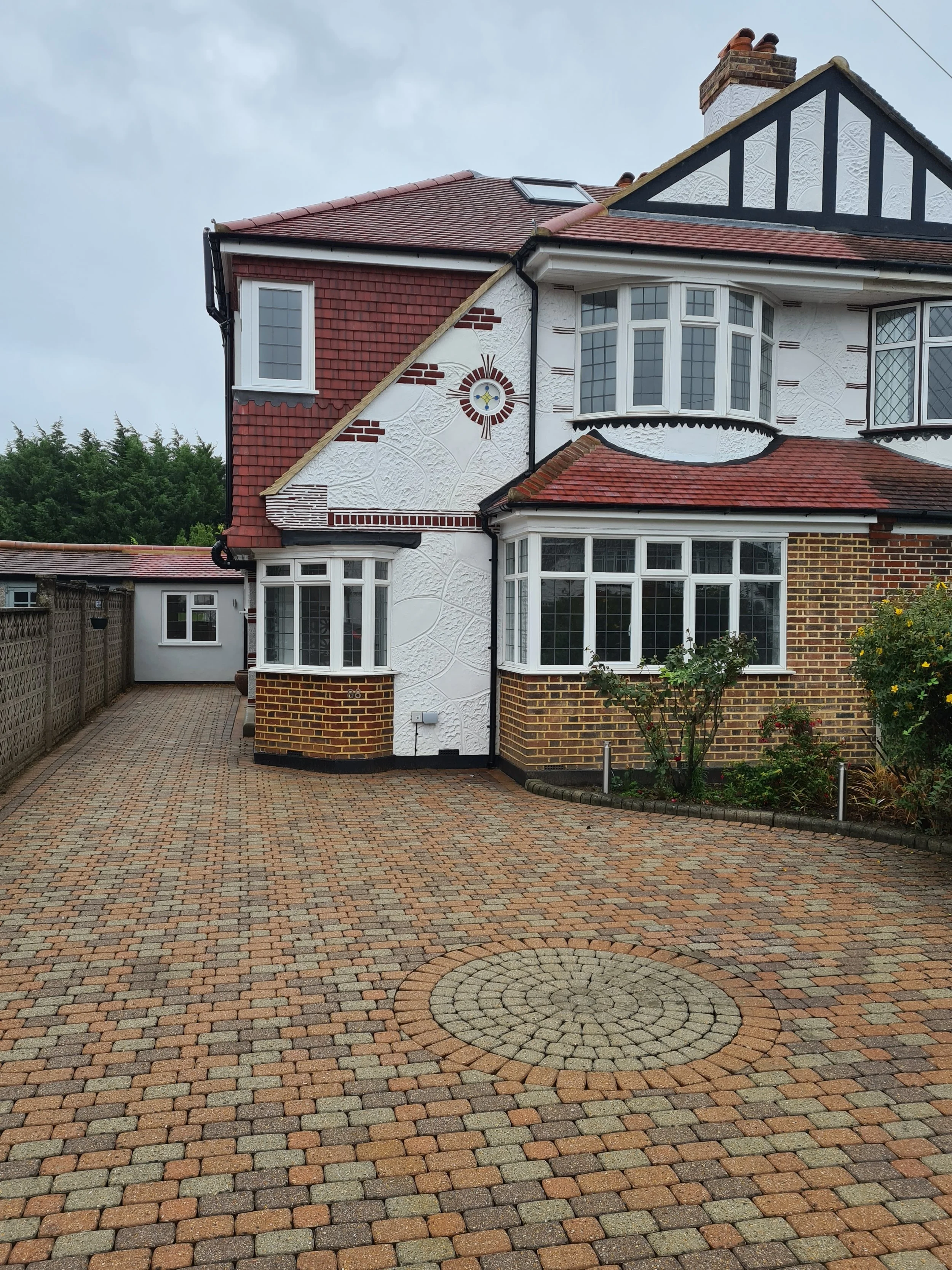 Single storey rear extension and garage conversion to semi-detached house in Surrey