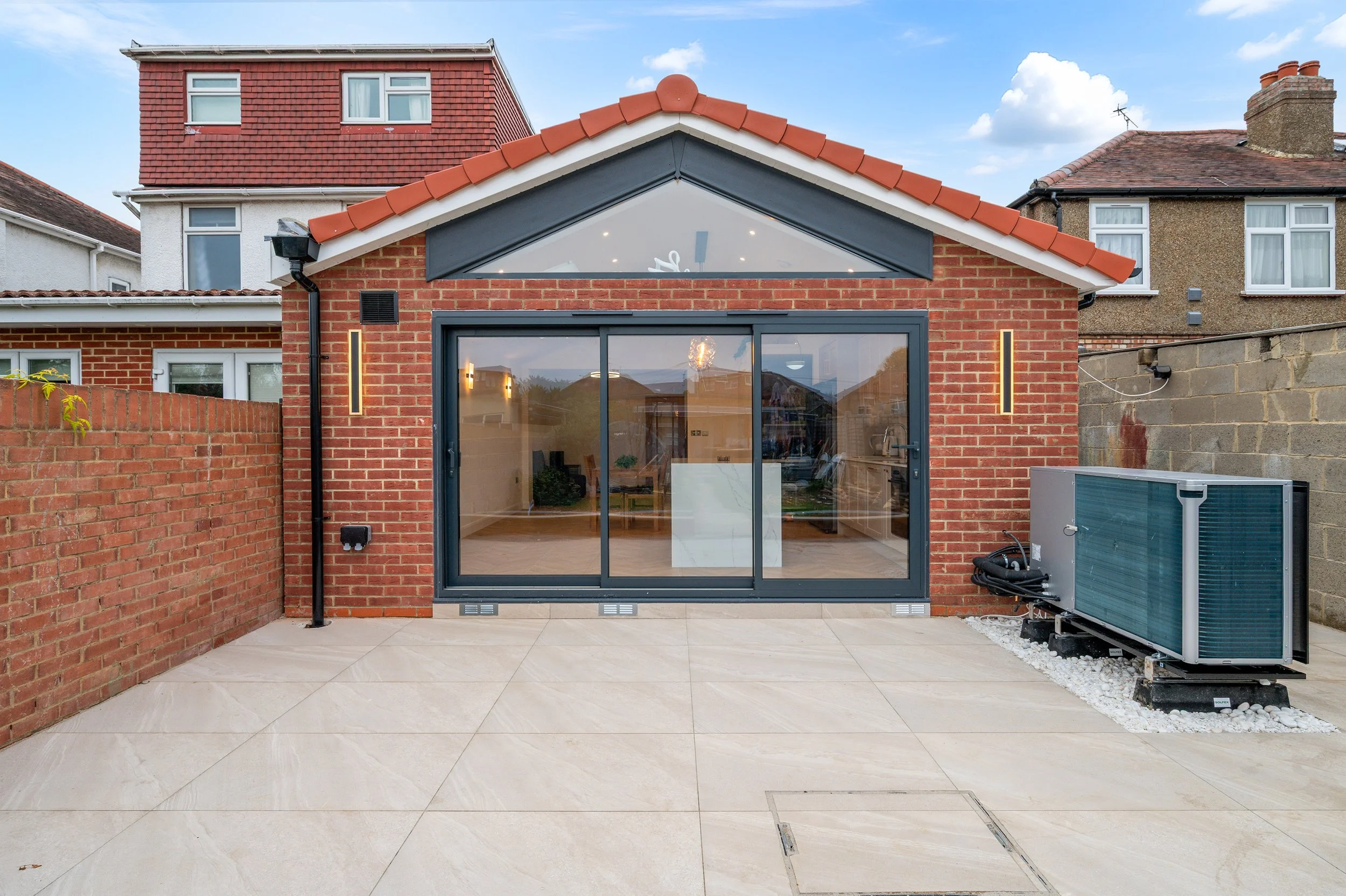 Single storey rear and front porch extensions to semi-detached house in West London