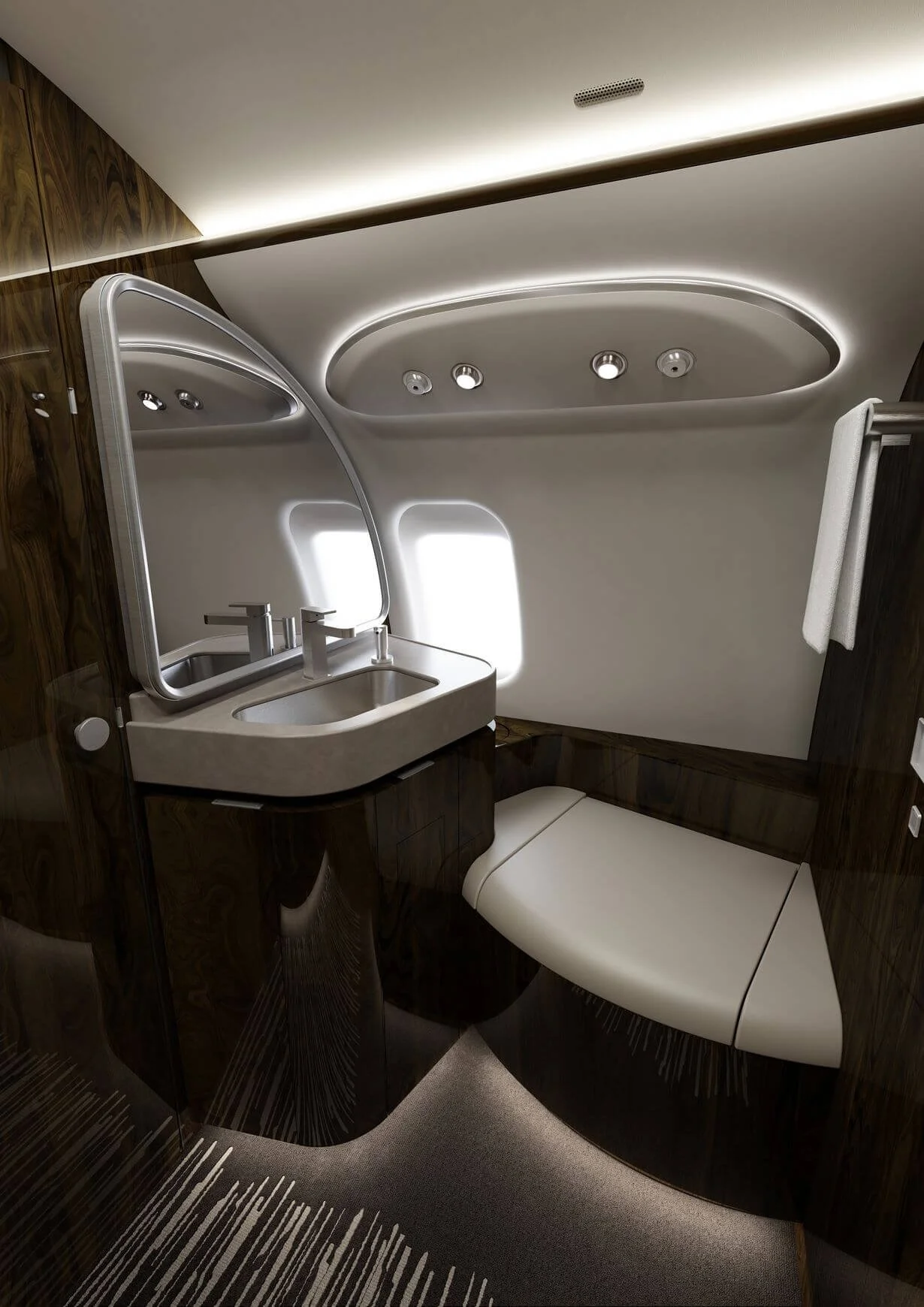 Luxurious airplane bathroom interior with wood paneling, a modern sink, large mirror, towel rack, and ambient lighting.