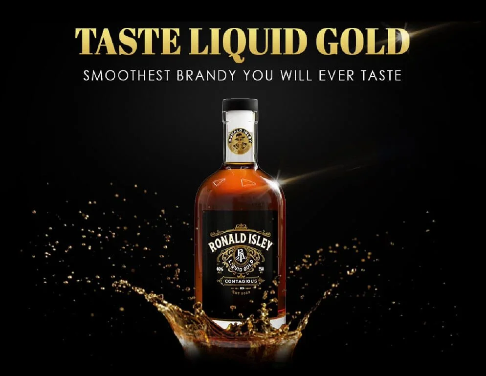 A bottle of liquid gold brandy with splash effects on a black background, with gold and white text promoting its smooth taste.