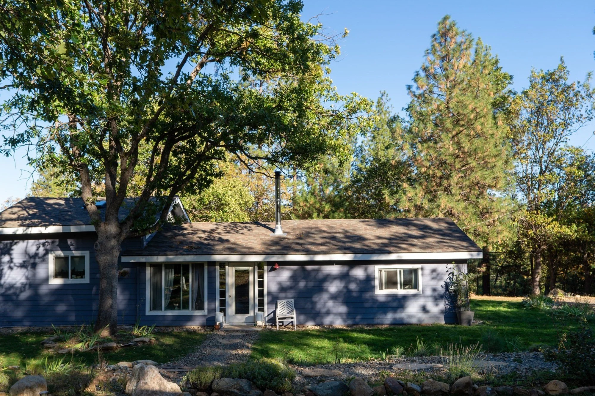 Blossom Sanctuary, the blue house under a big oak with pines behind it, just outside Etna, California
