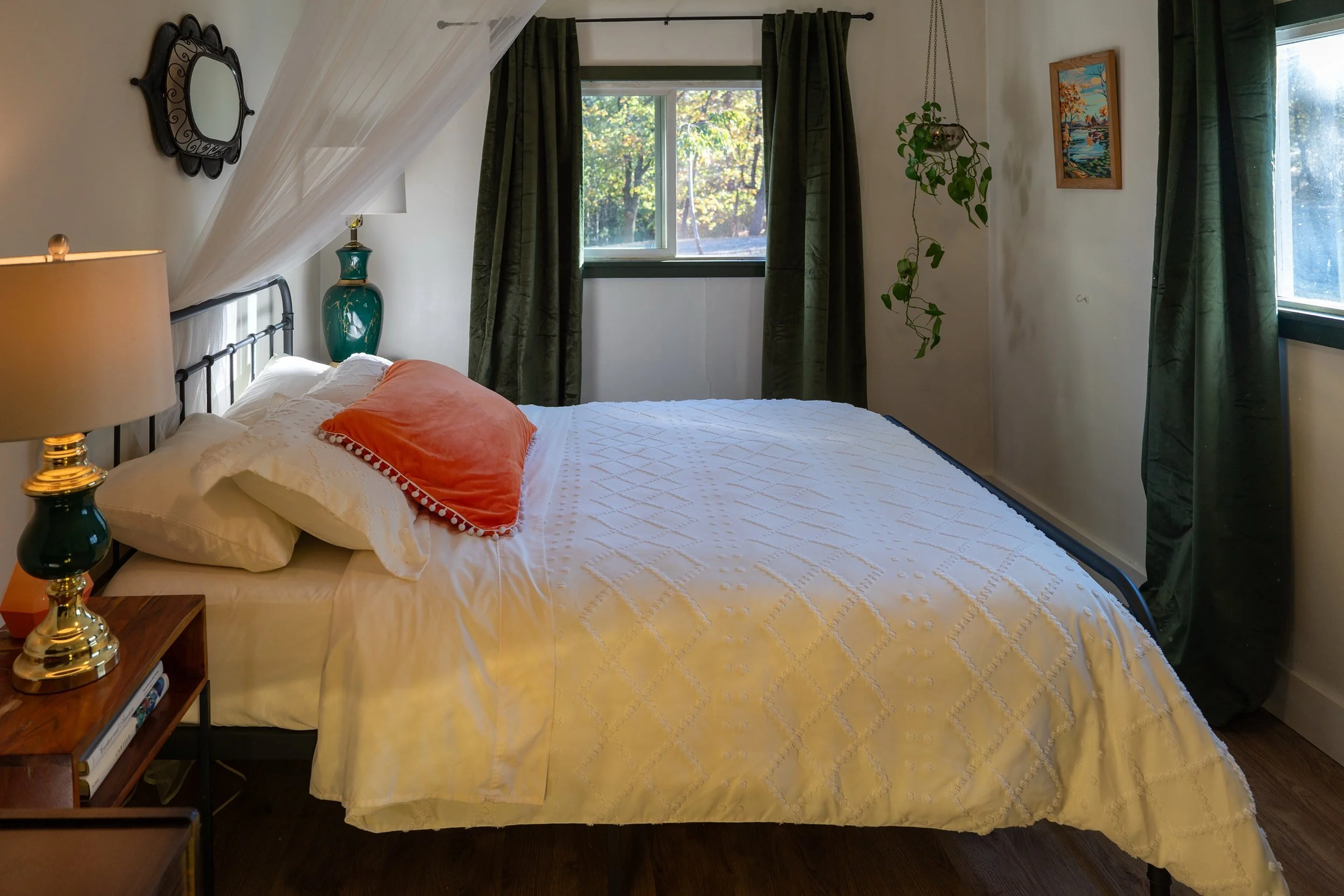 Queen bedroom with a canopy bed and garden window light at Blossom Sanctuary in Etna, CA