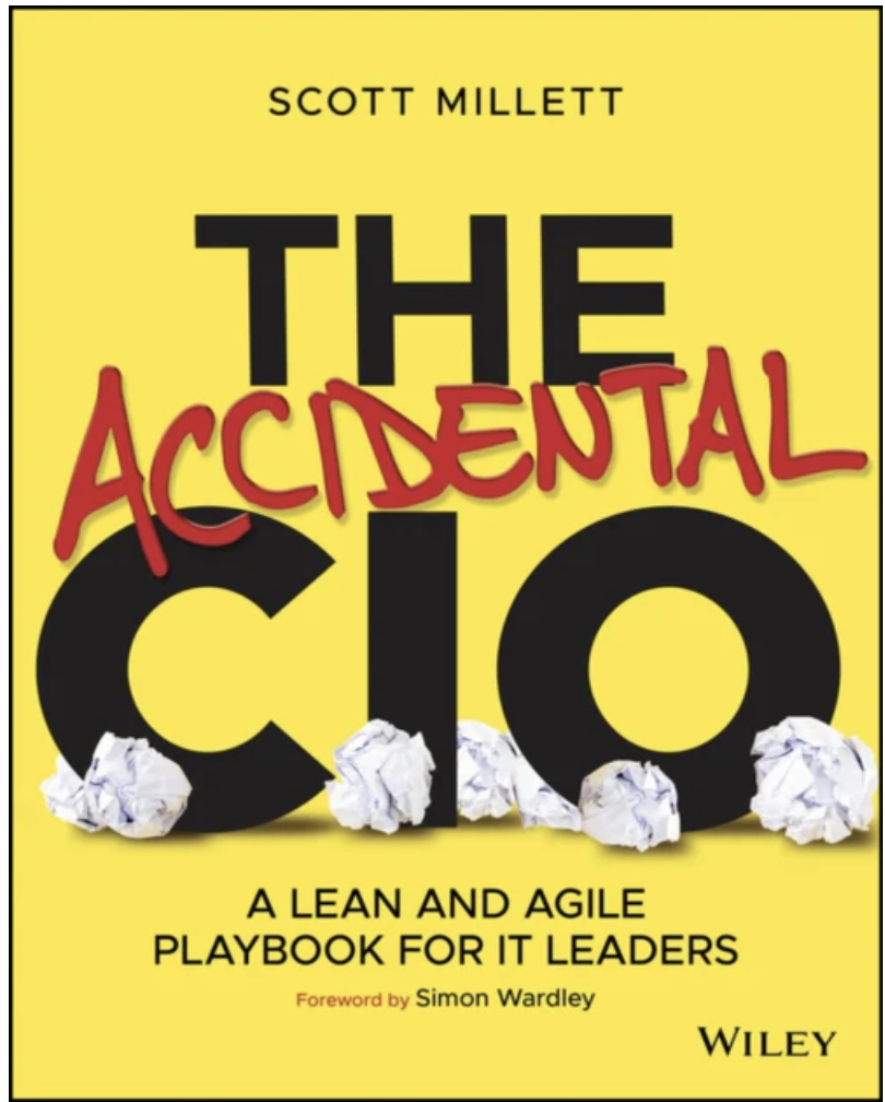 Book cover titled "The Accidental CIO" by Scott Millett, with a yellow background, large black title letters, crumpled paper balls at the bottom, and a red handwritten style word "Accidental" crossing out part of the letter "A".